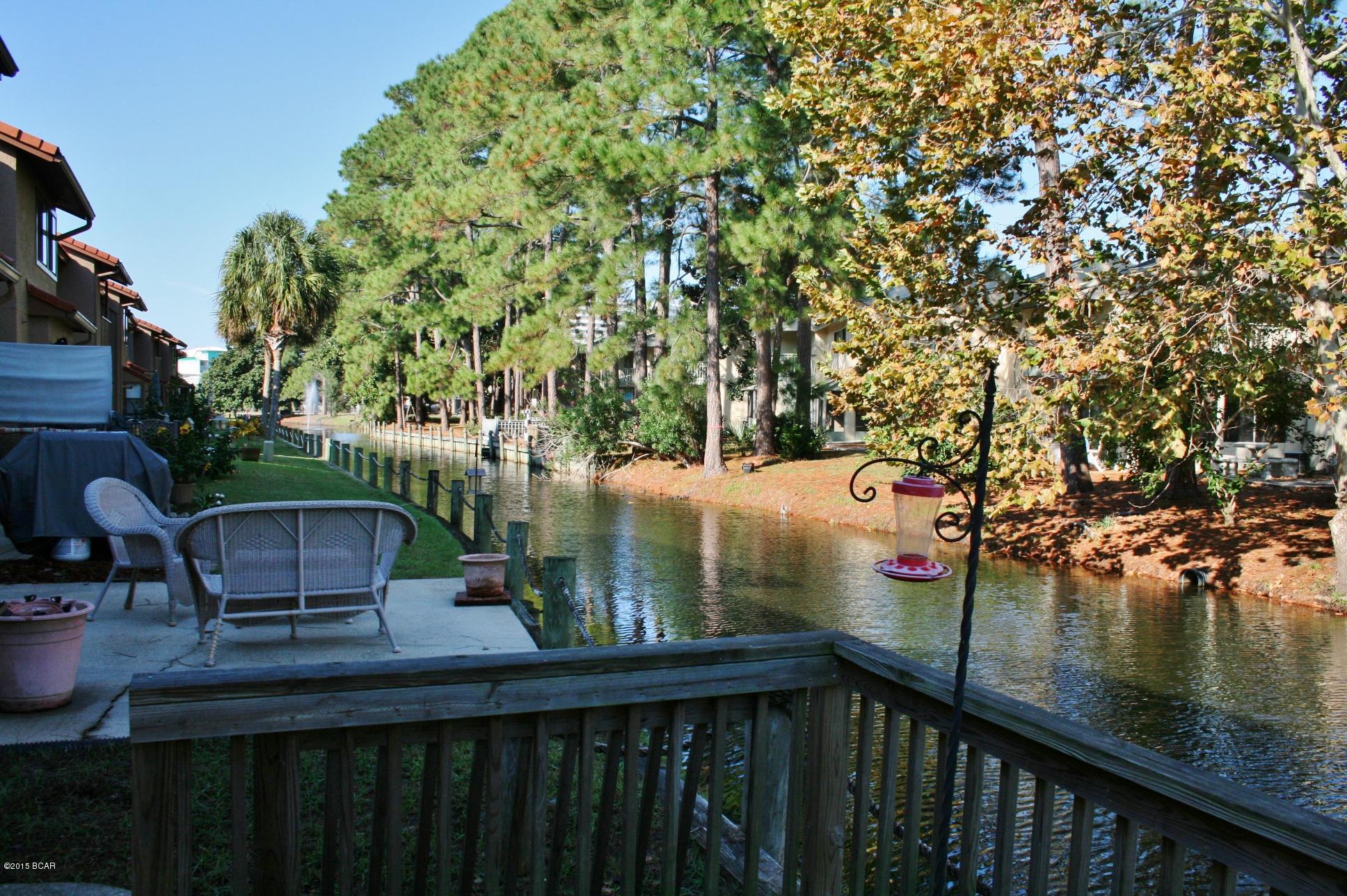 Come and check out this 2 BR ''Island'' unit backing up to the Canal and across the street from the Large Lagoon Pool, in Gulf Highlands Beach Resort. This unit already has Hurricane Shutters installed, New Cabinets, New Granite, New Tile Floors. You can sit on the back Patio and enjoy the Canal or fish. This "Gated Resort" features 11 Pools (5 Heated), 4 Tennis Courts (2 Lighted), An 18 Hole Putt Putt Golf Course, several Shuffleboard Courts, a Conference Center, Fitness Center, Wi-Fi rooms, and a Clubhouse with a Pool directly on the Beach... there is NO EXTRA CHARGE to use any of these amenities. This Resort is great for Walking, Jogging, and Bike Riding. You even own the 2 Parking Spaces in front of your unit along with the Front & Back Yard. NO Elevators to wait on and NO hunting for a Parking Space! This is not a "Condo", so they are much easier to This "Gated Resort" features 11 Pools (5 Heated), 4 Tennis Courts (2 Lighted), An 18 Hole Putt Putt Golf Course, several Shuffleboard Courts, a Conference Center, Fitness Center, Wi-Fi rooms, and a Clubhouse with a Pool directly on the Beach... there is NO EXTRA CHARGE to use any of these amenities. This Resort is great for Walking, Jogging, and Bike Riding. You even own the 2 Parking Spaces in front of your unit along with the Front & Back Yard. NO Elevators to wait on and NO hunting for a Parking Space! This is not a "Condo", so they are much easier to get a loan on. The HOA dues are only $420/Qtr equals ($140/month) the dues include trash, cable, some pest control, termite bond, lawn mowing, sprinklers, and of course ALL the amenities. Gulf Highlands Beach Resort is Great for Weekly Rentals, Snowbirds, or for that Affordable Getaway Home at the Beach!!!  There is a 2 pet maximum per unit with a 25lb weight limit per pet. Age, SF, and Dimensions are approximate... please verify if important.