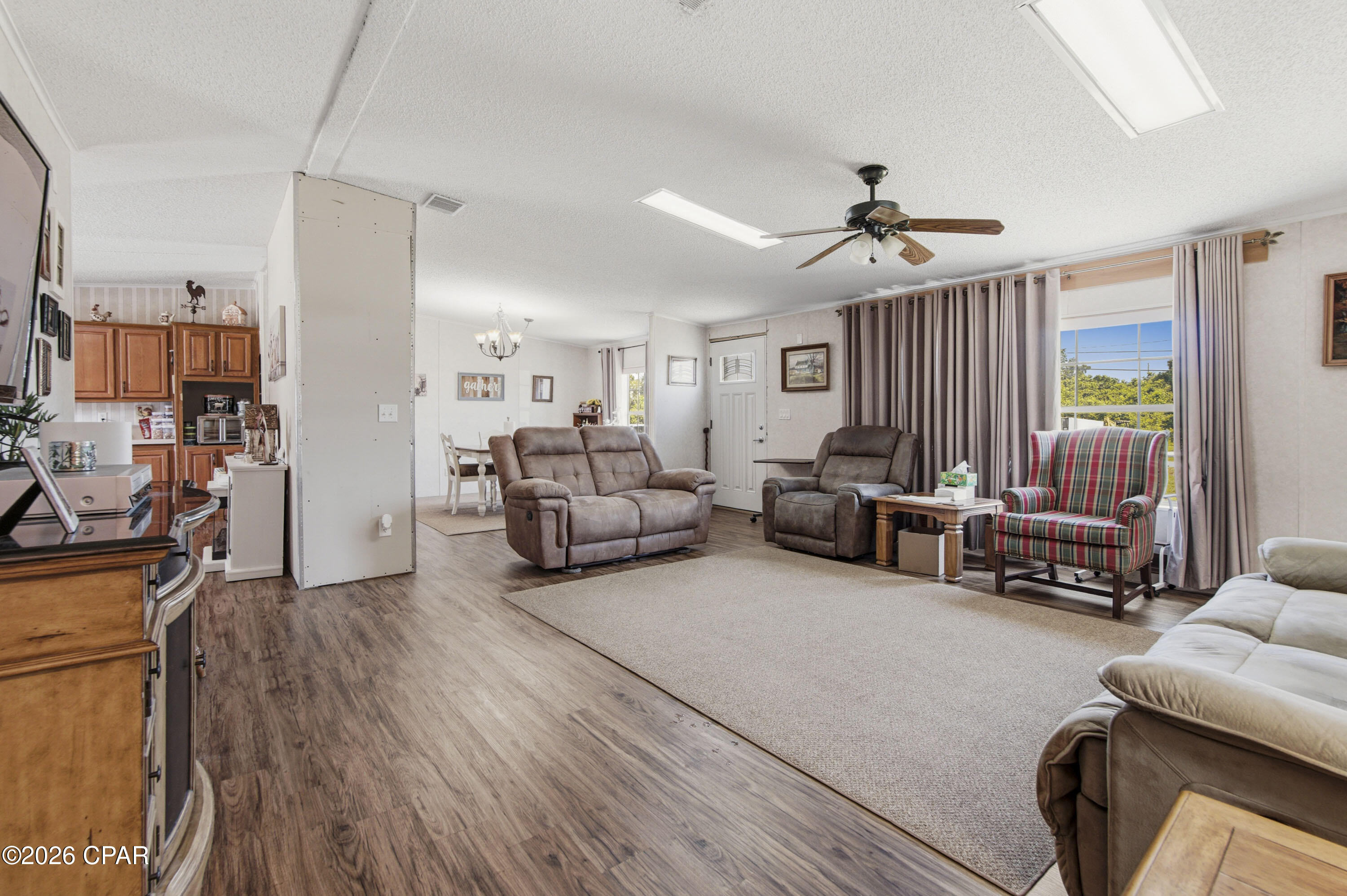Room to Spread Out--Inside and Out!
This spacious 2,393-square-foot manufactured home located on .633 of an acre. Home offers 3 bedrooms, 2 bathrooms, plus a large bonus room that is currently being used as a fourth bedroom. An additional laundry room provides extra convenience and flexibility.
The kitchen is designed for both everyday living and entertaining, featuring abundant cabinet and counter space, a large pantry with built-in shelving, a center island, smooth-top range, refrigerator, and dishwasher. (Pie safe does not convey; pantry shelving units remain.) Durable luxury vinyl plank flooring flows throughout the kitchen, dining area, and pantry, while the bedrooms and bonus room are comfortably carpeted.
Step outside to enjoy the 25' x 30' open concrete patio overlooking the large backyard, enclosed with a combination of chain-link and privacy fencing. RV owners will appreciate the 20' x 20' motorhome pad complete with water and electric hookups. The property also features two water heaters, providing added convenience for a busy household.
Conveniently located just minutes from Tyndall Air Force Base, shopping, medical facilities, and the beautiful white-sand beaches of Panama City Beach, this home offers the perfect combination of space, functionality, and location. Whether you're looking for room to grow, space for guests, or a place to park your RV, this property is ready to welcome you home!