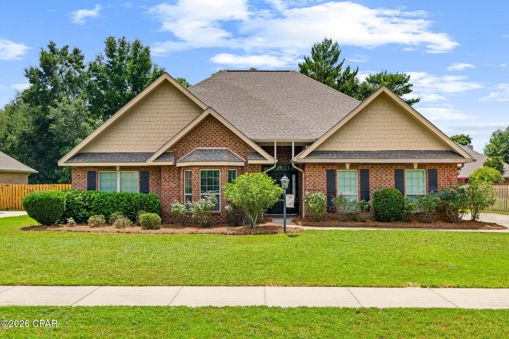 Welcome to this gorgeous and well-maintained Preston floor plan located on a spacious lot in the gated Lake Merial community. This thoughtfully designed home features an open layout with high ceilings, arched doorways, crown molding, and abundant natural light throughout. 

The formal dining room showcases a tray ceiling with detailed features and trim work, while the kitchen offers a center island, pantry, generous cabinet and counter space, and an area ideal for casual dining.

The primary suite includes a tray ceiling, walk-in closet, and an ensuite bathroom with dual vanities. Additional living spaces provide flexibility for everyday living and entertaining, or a flex space for an office.

Step outside to a fully privacy-fenced backyard with a beautifully maintained lawn, offering space to relax, play, or garden. The irrigation system is supplied by a dedicated well, and the irrigation well pump was replaced approximately one year ago. Home comes with protective hurricane rated window coverings fitted for all windows, offering benefits on insurance costs. Lovely yard building perfect for lawn equipment storage. Sidewalk-lined streets throughout the community provide opportunities for walking and enjoying the neighborhood setting.

Conveniently located approximately 8 miles from shopping, dining, and healthcare in Lynn Haven, 10 miles from Northwest Florida Beaches International Airport (ECP), about 15 miles from Panama City Beach and Pier Park, and approximately 20 miles from Tyndall Air Force Base.