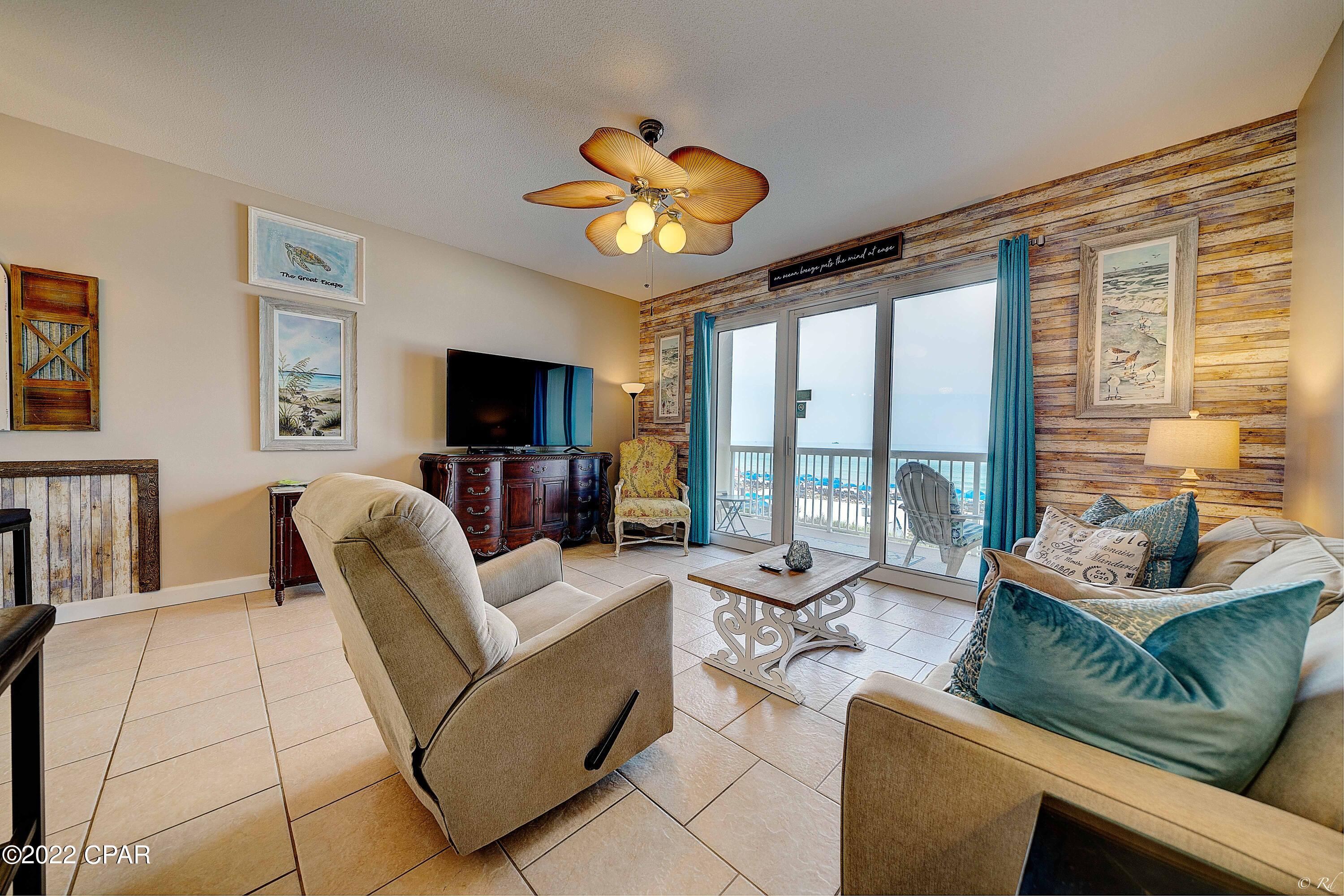 CURRENTLY UNDER CONTRACT. SELLER ACCEPTING BACKUP OFFERS.   Beautifully updated second floor 1 BR/2BA unit located at the East end of Panama City Beach overlooking stunning emerald waters and white sand!  Seychelles is within walking distance to St. Andrews State Park, recreational boating activities, marinas,, restaurants and right next door to popular Schooners.  Seychelles offers two pools with hot tub, beach access, fully equipped gym, community room and garage parking.  All new stainless steel appliances such as a counter depth French door refrigerator, built in microwave/oven,and a Bosch silent dishwasher have been installed along with a deep double sink, faucet, garbage disposal and new tile backsplash in the kitchen. New bedroom furniture, memory foam mattresses, LED lighting fixtures, curtains, area rugs, new TV dresser and 65" Smart TV, table lamps with built in USB ports, freshly painted and wallpaper accents are just some of the updates and personal touches from the owner.  Already on a rental program (sleeps six) thru Real Joy with the summer nearly booked!  Call now for an appointment to see this stunning unit today!