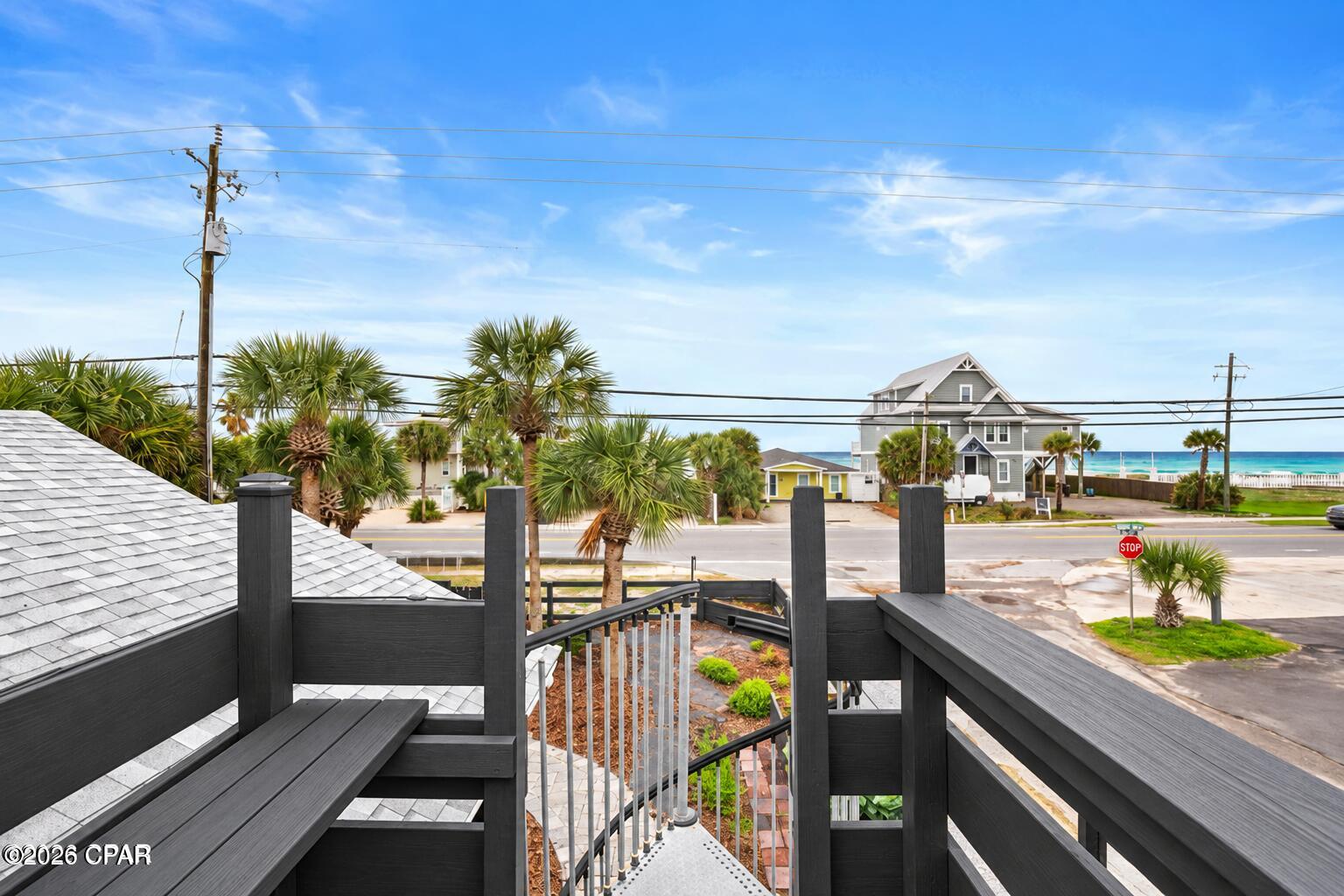 Just 250 feet from Public Beach Access 76A, this West End beach cottage offers Gulf views, STR eligibility and rare Commercial High Intensity (CH) zoning--creating exceptional flexibility for both personal use and investment. Enjoy Gulf views and sunsets from the private lookout deck, plus an open-concept interior with vaulted ceilings, fireplace and updated kitchen with quartz countertops. Covered outdoor living, an outdoor shower, pavered grounds, 16' x 20' storage shed and golf cart make beach living easy. Historical plans previously approved for the property illustrate the potential for a rear addition featuring a 2-car garage with 2 bedrooms and 2 baths above; plans are provided for conceptual purposes and would require current approval and permitting. Recent improvements include the roof, HVAC, water heater, appliances and solar panels. Located minutes from Pier Park, Thomas Donut & Snack Shop, Carousel and the best of Panama City Beach's West End. Live here, rent it, expand it or explore the possibilities offered by commercial zoning.
