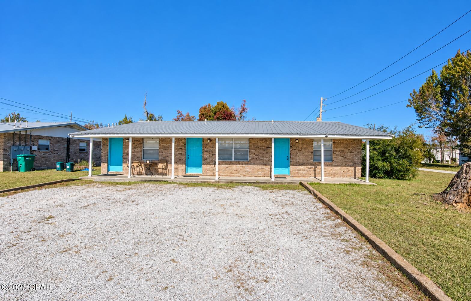 Charming 1 bedroom, 1 bathroom corner unit with an open living room and kitchen concept! This cozy apartment features a brick exterior with a newer metal roof, a covered front porch, and a dedicated parking spot right at the front door for easy access. Inside, you'll find fresh paint throughout, a functional kitchen equipped with a refrigerator and stove, and a comfortable bedroom offering two closets for extra storage. The bathroom includes a convenient tub/shower combo.**Garbage and Lawn Care included. One assigned parking spot ** No Pets** Located just off Tyndall Parkway, this unit is close to shopping, restaurants, and local businesses, and a short commute to Tyndall AFB. --perfect for easy living in a convenient location!