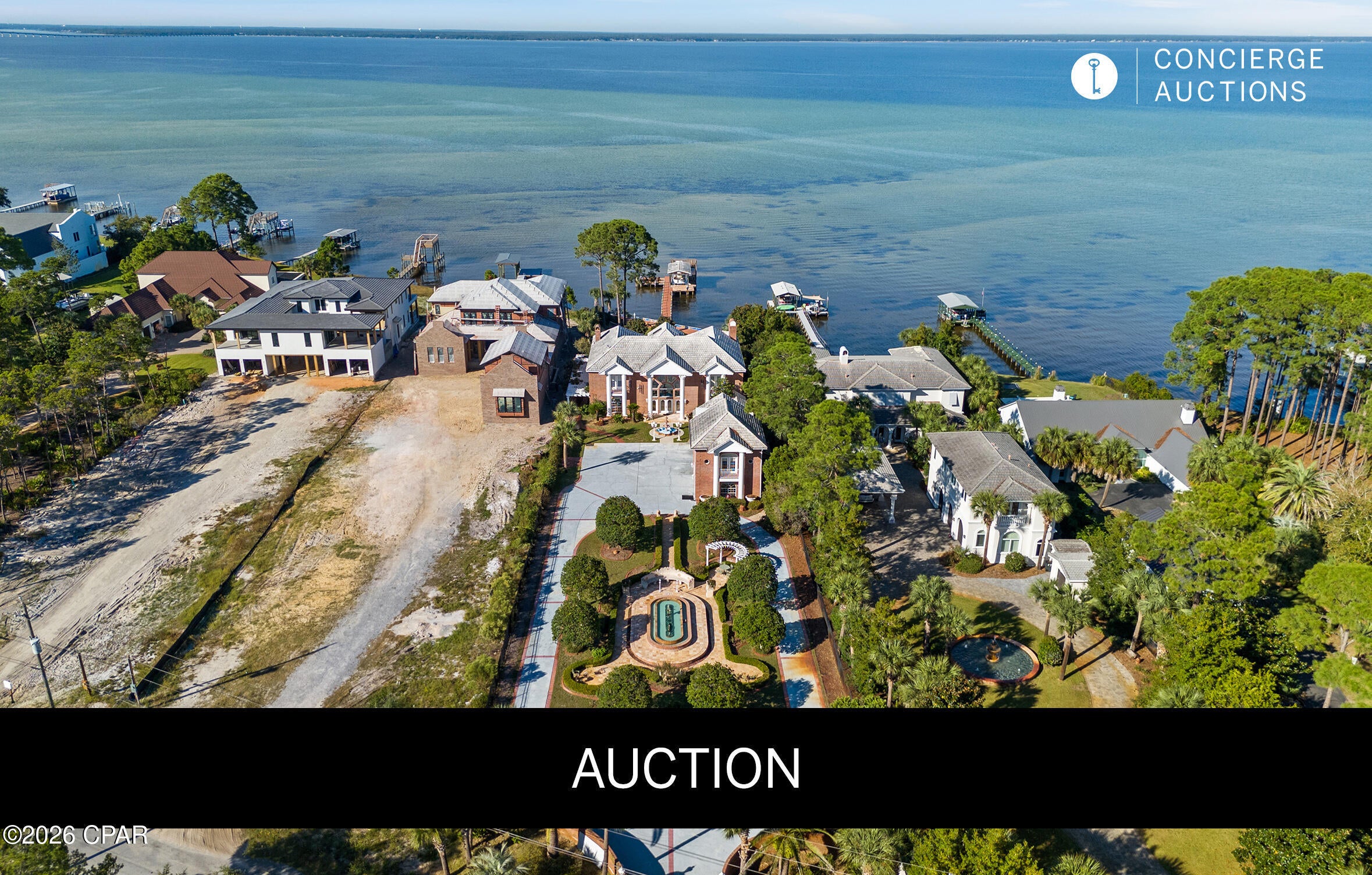 ***AUCTION: BIDDER REGISTRATION DEADLINE: SEPTEMBER 16TH. STARTING BIDS EXPECTED BETWEEN $1M-$2M*** An exceptional bay front villa estate in Miramar Beach pairs old world craftsmanship with refined coastal living. Two hand carved curved staircases, a coffered ceiling with stained glass, and Italian marble floors set an unmistakable tone from the moment of arrival. Immaculate gated grounds welcome with mosaic fountains, marble statuary, and manicured gardens, while a built in bar imported from England anchors the billiards room and den. A heated atrium pool, private dock with covered boat lift and 107 feet of seawall protected waterfront invite effortless entertaining and quiet reflection alike. A separate guest cottage above the four car garage completes an estate built for gracious bay front living. All information is approximate and should be verified by buyers if important.