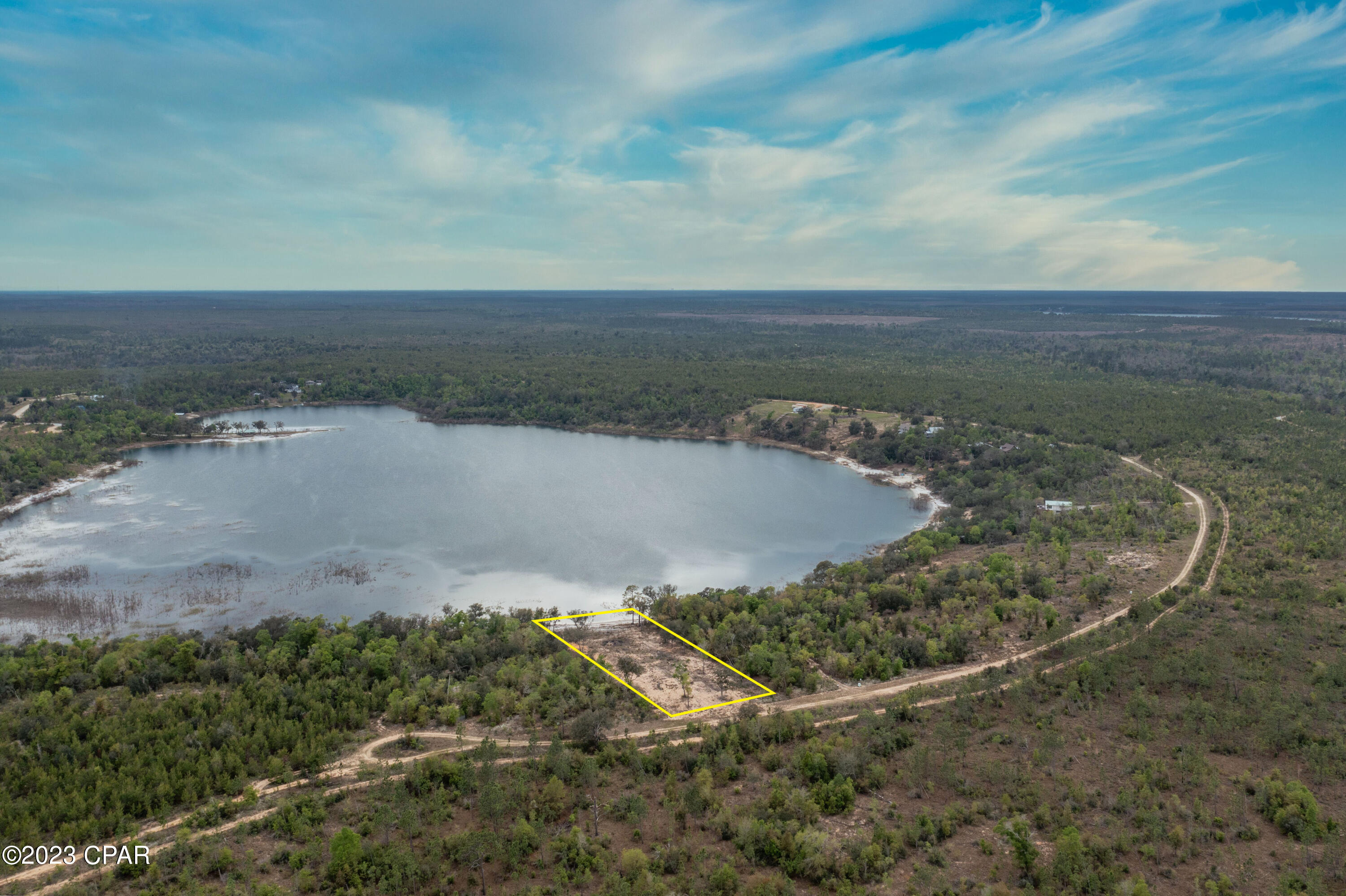 Cleared and ready for your dream home, this 1-acre waterfront lot is secluded in the gated community of Hammond Lake. This spring fed paradise is conveniently located near Hwy 231 approximately 20 minutes from Panama City. Other amenities include underground power with service pole and community pavilion.