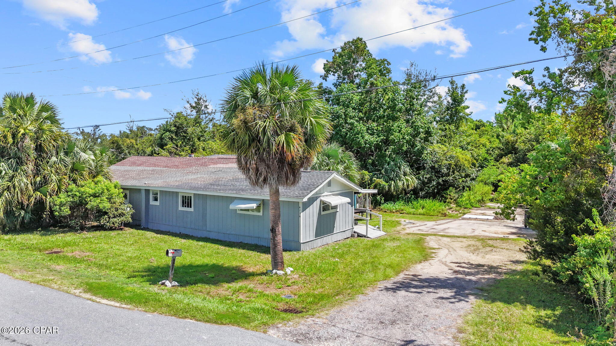 INVESTOR OPPORTUNITY WITH DEVELOPMENT POTENTIAL! This 1,800+ square-foot home sits on a beautiful oversized lot of more than 3/4 of an acre, offering an incredible opportunity for investors, builders, or buyers looking for a property they can transform. The home is in need of completion and renovation, but the potential is undeniable. This location is hard to beat! Just two seconds from the McKenzie Boat Ramp, providing quick access to Fanning Bayou and out to the Bay. You're also only approximately 2 minutes from the Lynn Haven Bailey Bridge and zoned for Southport schools. The property itself is a standout, featuring multiple mature palm trees, beautiful flowering trees, an insane amount of parking space for your boat, RV, outdoor toys, and plenty of room to bring your visions to life. Even better, the large parcel offers the potential to be subdivided into three separate lots for new construction, creating multiple possibilities for development, resale, or investment. City water and sewer are available. DO NOT MISS THIS ONE!!!