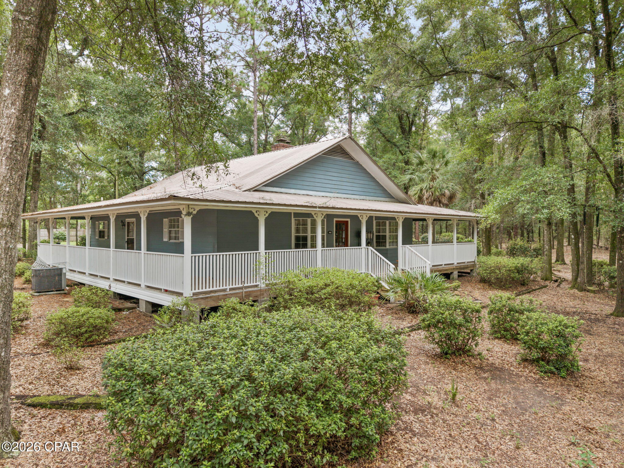 Tucked away on a quiet dead-end road and surrounded by mature oak trees, this peaceful 2-bedroom, 1-bath country home sits on a little over 5 acres and offers true privacy in a serene rural setting. A welcoming wraparound porch invites you to relax outdoors, while the property features a large pond and various fruit trees that enhance the natural charm.
Inside, a wood-burning stove warms the living room, and the primary bedroom stands out with a spacious sitting area and its own wood-burning fireplace--perfect for cozy evenings. The home also includes an indoor pool, already equipped for propane heating (the system needs some maintenance to get it fully operational again). Propane is already on site and could easily be extended for future home heating if desired.
Conveniently located just under 4 miles from Interstate 10 and only 45 minutes from the beach, this property combines peaceful country living with easy access. A rare combination of privacy, outdoor beauty, and unique indoor amenities awaits.