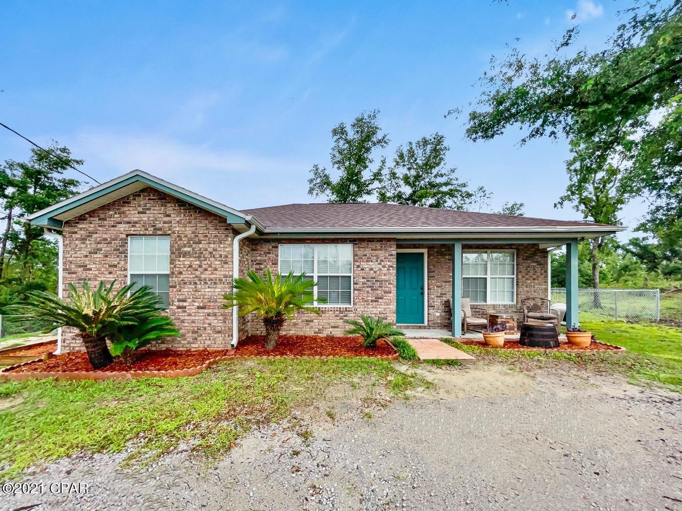 ***Quiet Country Living with ACERAGE!!*** Come view this brick home in a very quiet, and private location! The home also features a bonus room! It is just 30 minutes to Tyndall AFB and not far from Econfina Creek, as well as Cherokee Landing boat ramp, where you can launch a boat, kayak or fish. This home offers a beautiful white kitchen with a large eat in dinning room, high top breakfast bar, lots of cabinets, and plenty of natural light. Off of the kitchen you will find a very large bonus room that would be great for using as a 4th bedroom, any number of hobbies, or a work out room. This home features 3 bedrooms and 2 bathrooms + the bonus room, which is also where the laundry room is located. This home is very clean and well kept. Outside of the home, you will find a screened in porch, leading out to the large yard where there is plenty of space! With an Acre and a Half of land, there is plenty of space to spread out! You will also find an exterior yard building with power to be used as your work shop or extra storage. There is also a creek that runs the property line down in the woods. With this property being wooded around the property line, you will always have privacy! Schedule your private showing today!