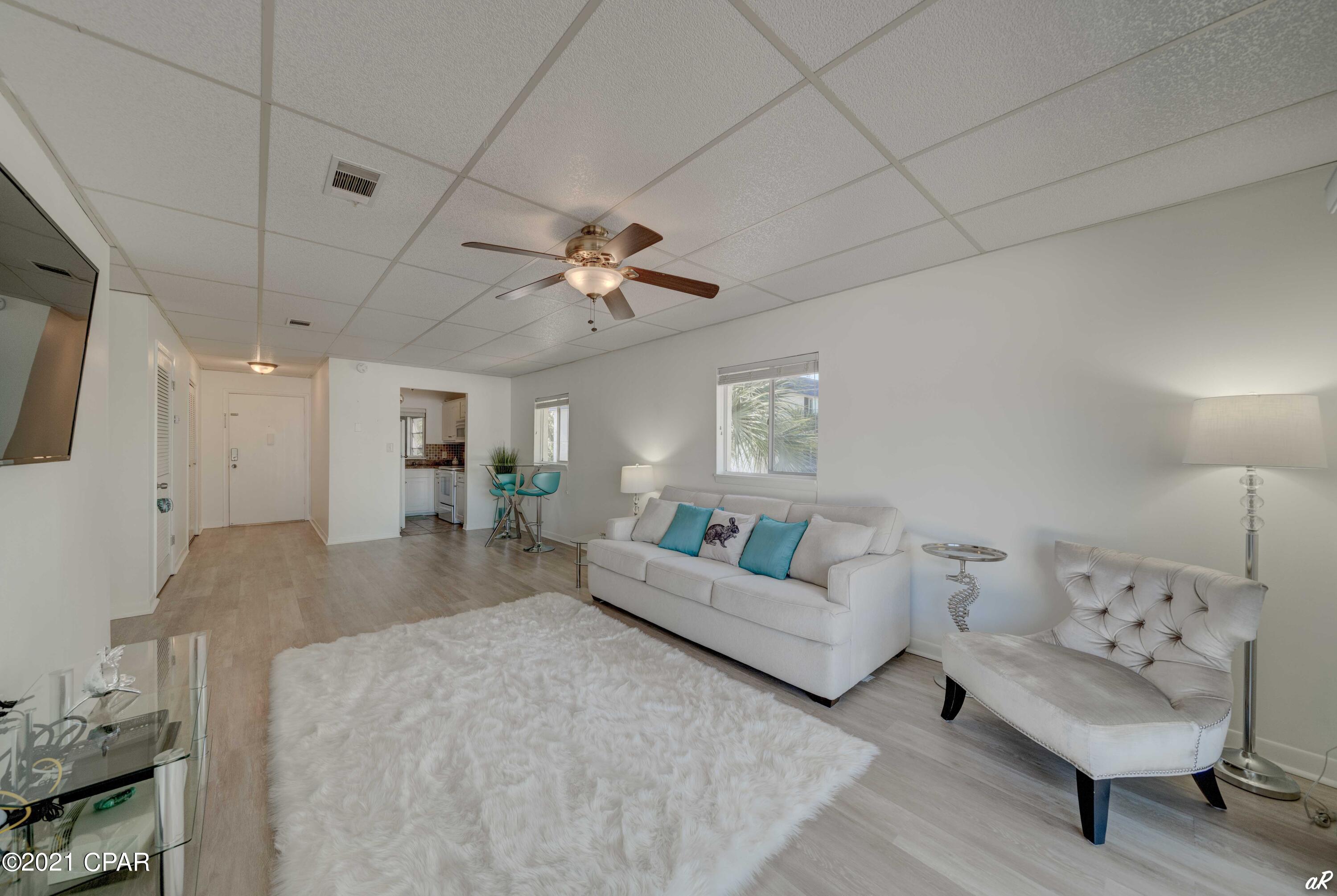WHAT A VIEW!!! Your fresh start is waiting at this FULLY FURNISHED pristine condo overlooking St. Andrews Bay in the highly sought-after historic neighborhood of The Cove. Enjoy the bayfront lifestyle in this gorgeous 1 bedroom, 1 bath end unit overlooking the Bay. Minutes from the Tarpon Dock Bridge, the Panama City Marina, and the local downtown shopping and brewery.  New LVP floors, paint, trim, ceiling tiles, composite decking on the balcony, Queen sleeper sofa. No expense was spared. Ride your golf cart around and enjoy the Sunsets surrounded by the Massalina Bayou and St. Andrews Bay. Just a short walk to the St Andrews Bay Yacht Club. The HOA payment covers building insurance, water, sewer, pest control, grounds keeping, pool, dock, and private beach usage, electrical for common areas, and security cameras. Buyer shall verify measurements deemed necessary.
