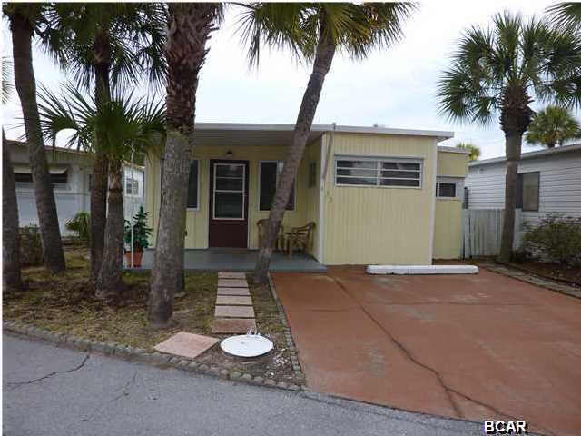 For years, visitors have been coming to Venture Out to enjoy the dedicated beach, beach side pool and club house. Here is a chance to own a 2 bedroom 2 bath Venture Out home, fully furnished and ready to move in. This property offers a great location, good condition, newer flooring and stackable washer dryer. Amenities also include tennis, mini golf, shuffle board, heated pools and security with guard gate. This well kept resort is located on the east end of Thomas Drive near St. Andrews State Park, ranked as one of the ''World's most Beautiful Beaches.