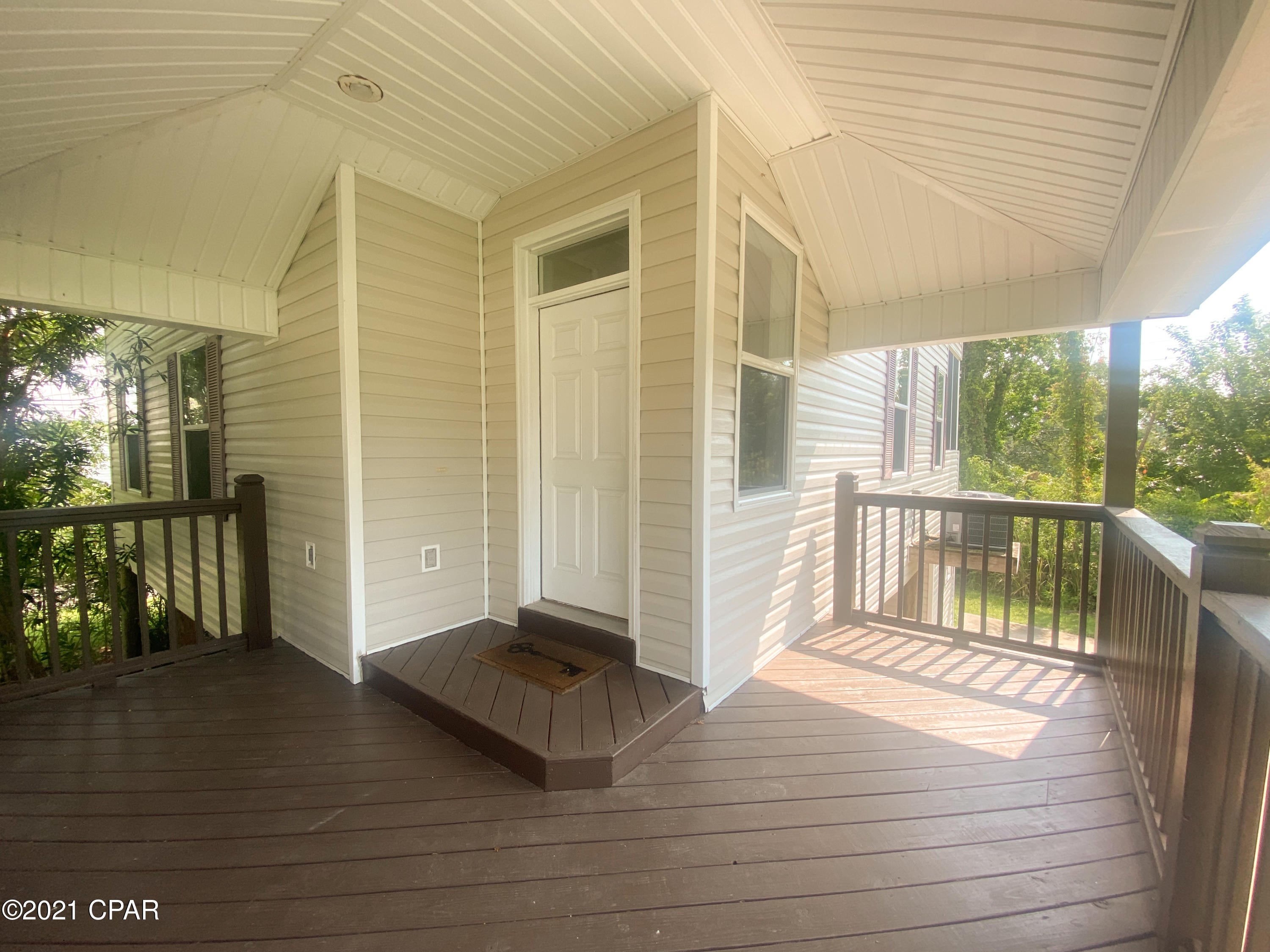 Florida Cottage in great location convenient to St. Joe's restaurants, shops and more! You don't want to miss this St. Joe Charmer. Enjoy high ceilings in the living area with great natural light. The upper deck has been converted into a Florida room that is directly off the living room with nice views of the pretty backyard. The kitchen boasts stainless steel appliances and a dining area just off the living room. Both guest bedrooms, the shared downstairs bathroom and the laundry area are located on the first floor as well. You will find the master suite upstairs with high ceilings and two walk-in closets. The master bathroom is quite spcaious with two vanities, a garden tub and a walk-in shower. This home is move in ready!