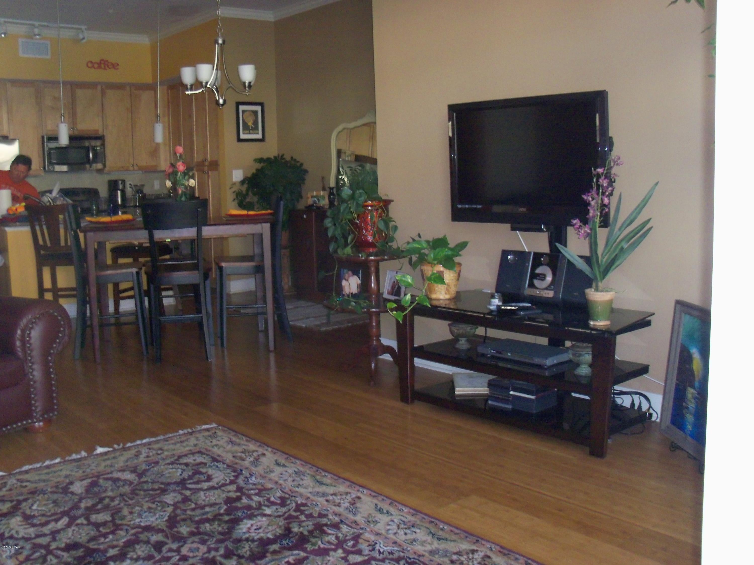 Beautifu, interior (no traffic noise) 2 bedroom, 2.5 bath condo.  Condo features bamboo flooring, granite countertops, stainless steel appliances, tile in kitchen, baths, and foyer.  Condo also includes new washer and dryer and window coverings.  Complex features gorgeous pool with waterfalls and splash pad.  There is a basketball court, media room, fitness room, and game room in the club house as well.