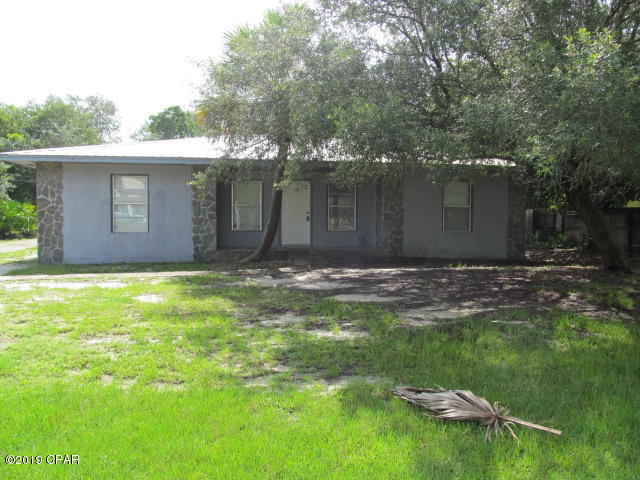 3 bedroom, 2 bath home featuring split bedroom floor plan., open living room with wood burning fireplace., large back yard. Property includes water and electricity. Electricity is capped at $250 per month. Property is on septic system. Driveway shared with small apartment NO PETS