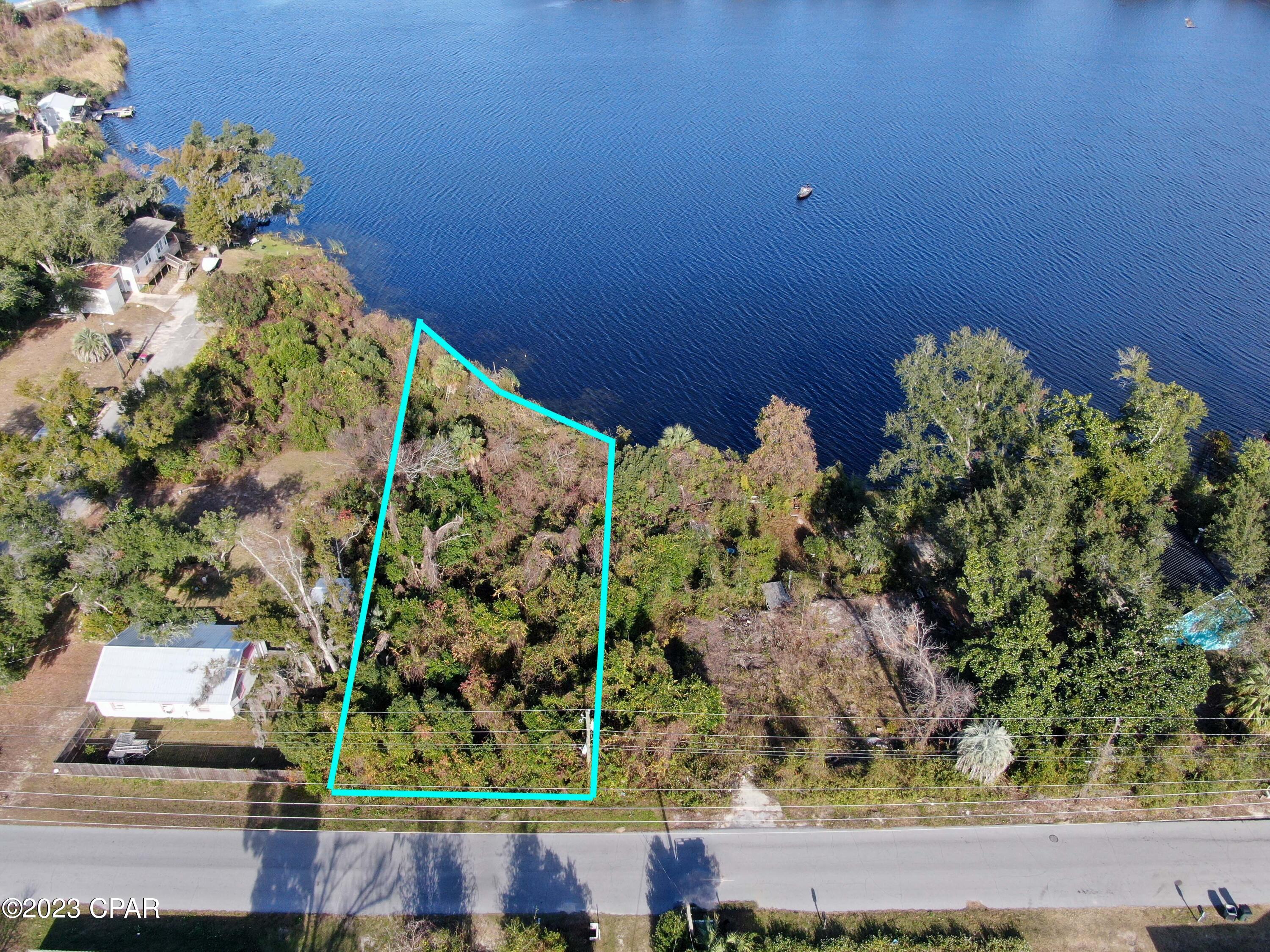Discover the allure of lakeside living with this prime waterfront lot on Lake Martin. Conveniently situated near easy access to Route 98 and just a short distance from the bay, this property on Horne Avenue boasts the convenience of Parker city water and sewer services. Imagine your dream home on this idyllic site, where the tranquility of lakeside living meets the accessibility of urban amenities. Hookup for water and sewer services is needed Don't miss the chance to make this picturesque lakeside lot your own. Flood zone is AE9.