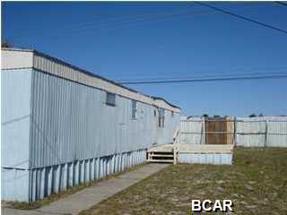 Located at the west end of Panama City Beach, this mobile home is available for immediate occupancy. 2 bedroom 1 bath. Located on the first block of Wisteria Lane, just off of Hwy 98. Measurements are approximant.