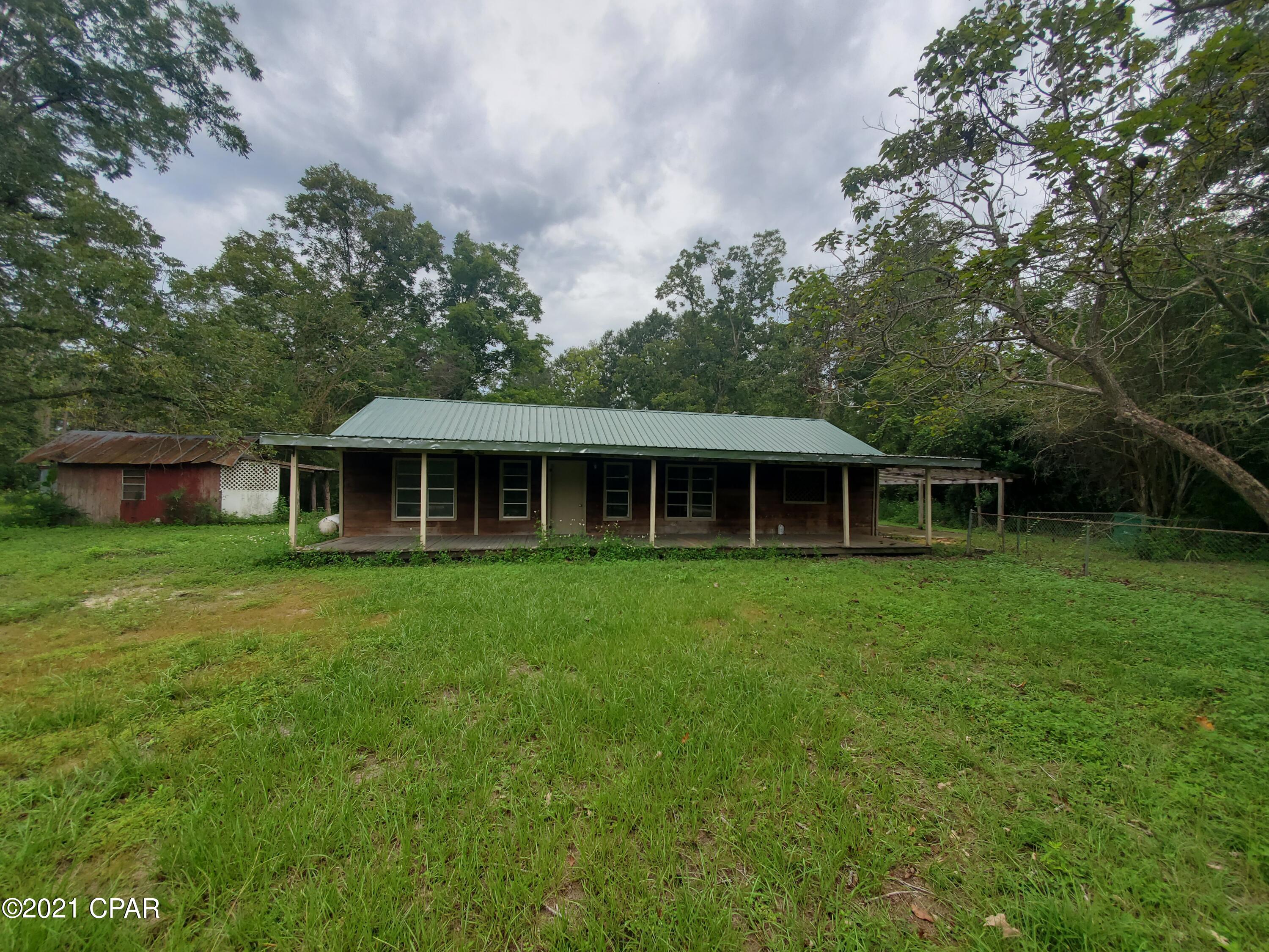 Looking for a re-hab property in Bristol FL?  We have the one for you.  It is on 5 acres with city water and sewer available and directly on NW CR 12 in Bristol only a minute from Tolar Middle School and 2 minutes from the new high school.  The home has a newer metal roof and the lot is mostly level with some mature trees on it.  Great potential here, don't delay.  Potential for owner financing with large down payment!