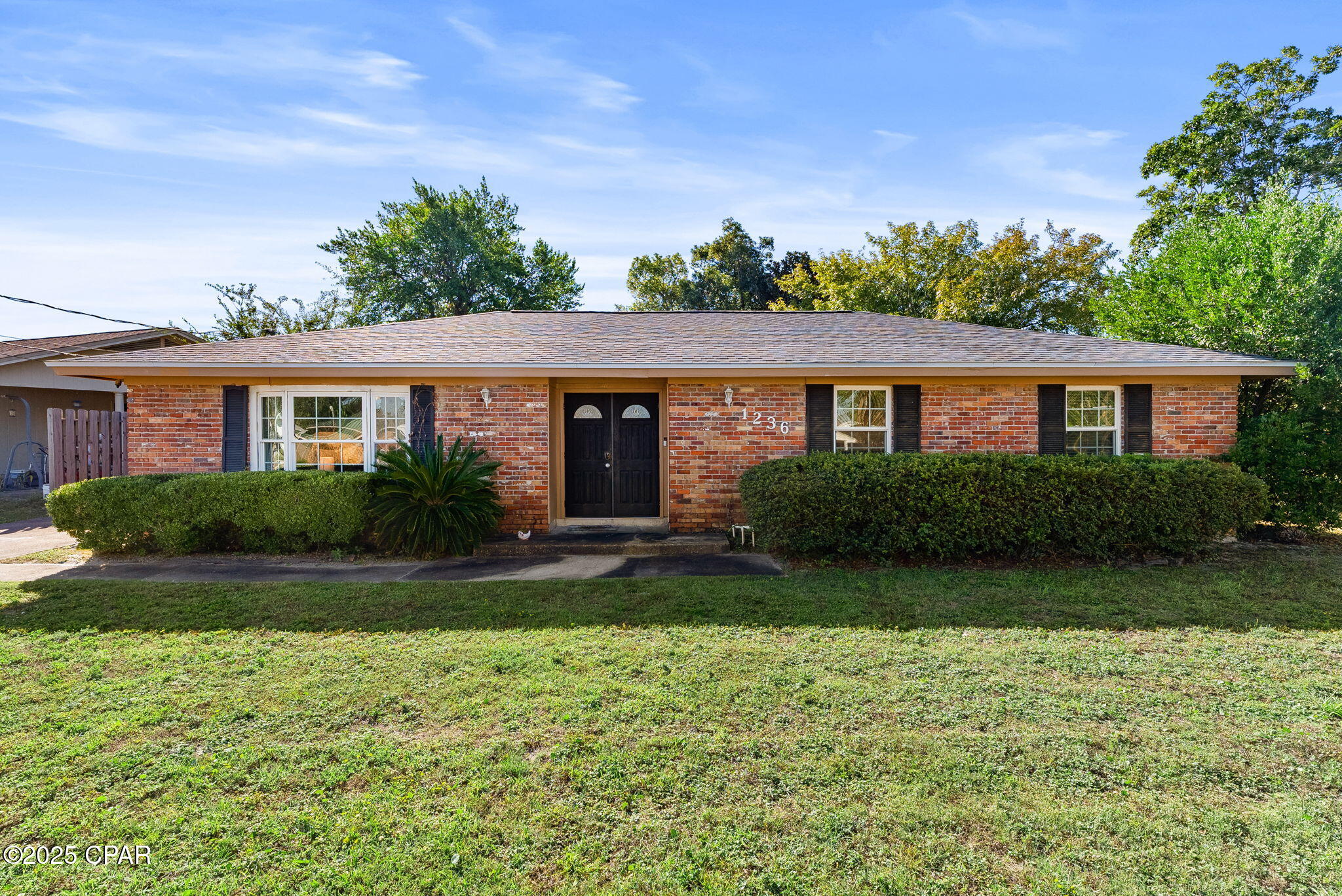 Major Price Reduction! The price has been reduced from $249,000 to $200,000 as the seller has elected to offer the property strictly in its present As-Is condition. Rather than completing or negotiating potential repairs prior to closing, the seller has chosen to pass that value directly to the buyer through a substantial price reduction, providing the opportunity to make any desired improvements according to the buyer's own preferences and budget.

This quality brick home is conveniently located in the heart of Panama City, just minutes from schools, shopping, parks, Tyndall Air Force Base, and the beautiful Gulf beaches. Inside, you'll find a spacious living area with luxury vinyl plank flooring throughout, offering both style and easy maintenance. The fully equipped kitchen features abundant cabinet space, a breakfast bar, and an open connection to the dining area, creating a comfortable layout for everyday living and entertaining.

The home offers three bedrooms and two full baths, including a primary suite with a private en suite bathroom. Step outside to enjoy the large covered rear porch overlooking a fenced backyard--an ideal space for relaxing, entertaining, pets, or play.

At this new price, this home presents an outstanding opportunity for buyers seeking value, location, and the flexibility to personalize the property to their own tastes.