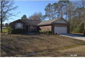 Gorgeous custom designed and built home located in Dune Creek, one of Bay County's newest and most popular neighborhoods. This 3 bedroom, 2 bath home was designed and built by the owner and there were no details spared. The kitchen has solid wood cabinets, tiled back splash, a kitchen island for extra storage, cable hookup and a stainless steel appliance package. separating the formal dining area from the kitchen is a breakfast bar attached to the kitchen island. Any chef would LOVE the countertop space and cabinet capacity! The living room is just off of the kitchen and features an electric fireplace with mantle (electrical outlets on top of the mantle and a vaulted ceiling making the already large living room feel HUGE. A split bedroom plan for privacy allow the master bedroom to be