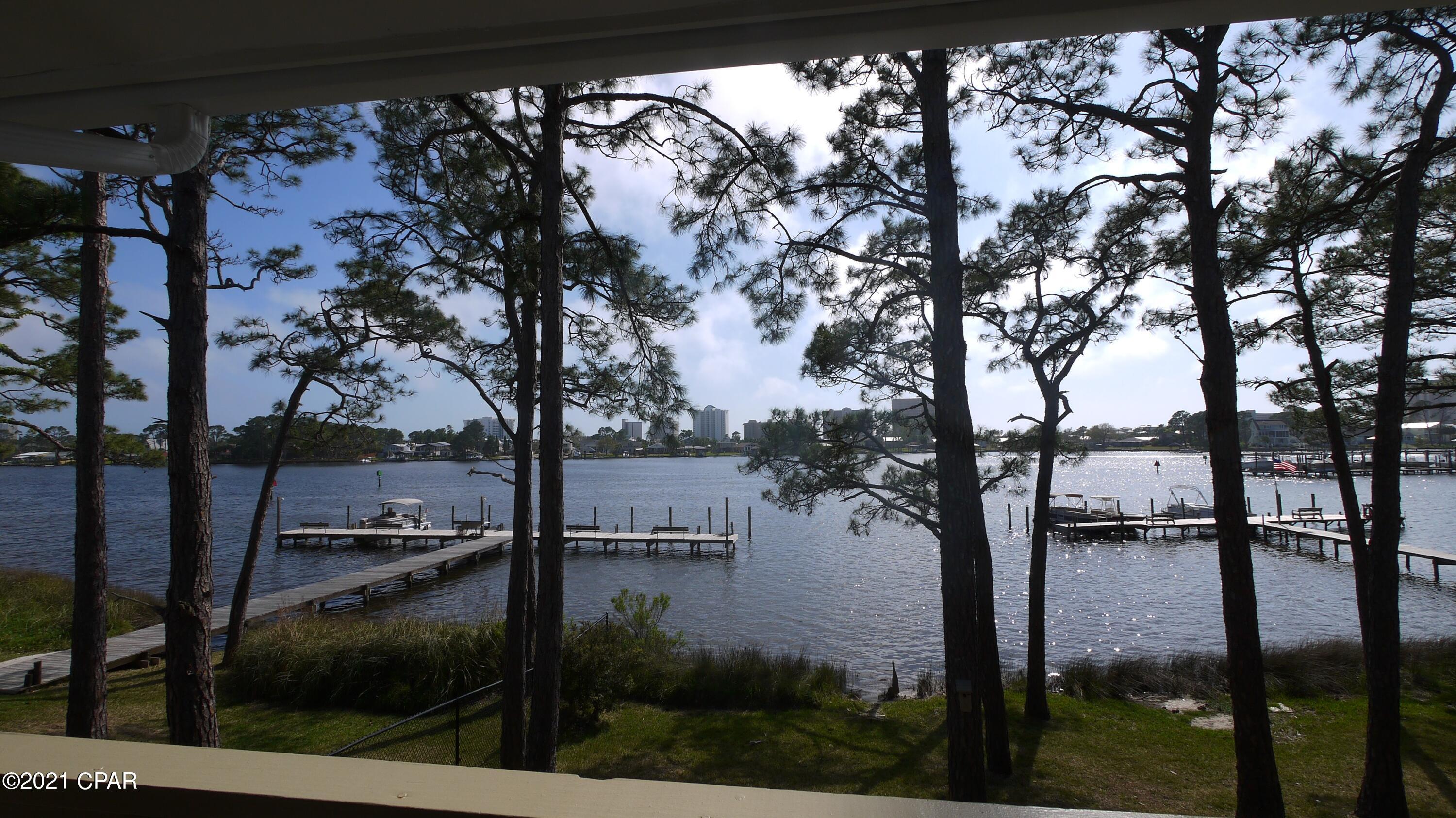 Available January 2022 - Enjoy amazing views from this 2nd floor corner unit -1 bedroom 1 bath Waterfront Condo on Grand Lagoon.  Rent includes water/sewer/trash/cable - Tenant pays electric, internet. Complex offers community pool, tennis court, and a dock on the Lagoon. No pets allowed. This unit is unfurnished.