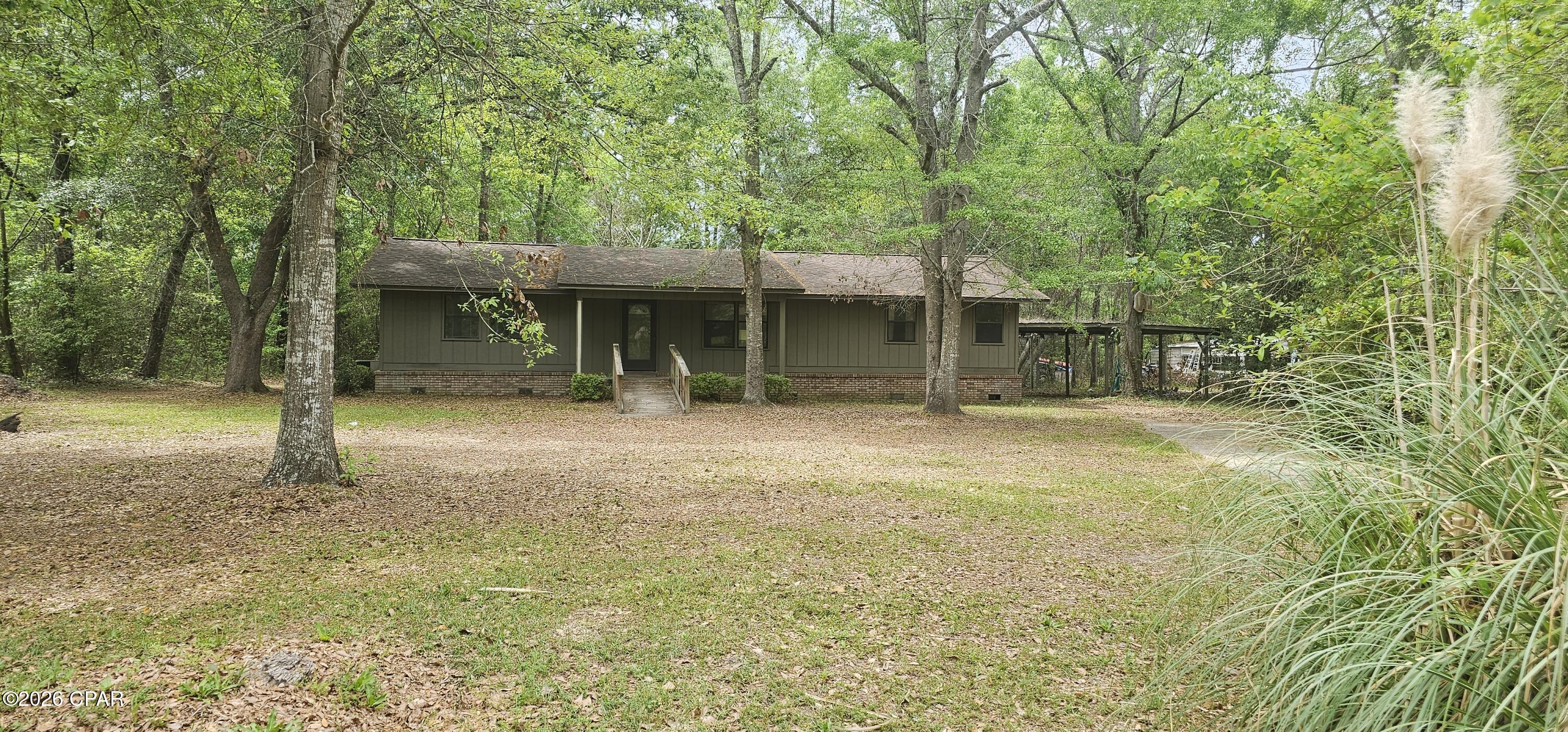 Discover the potential in this charming brick 3-bedroom, 2-bath home located in the heart of Blountstown. Nestled beneath several beautiful shade trees, this 1,475 sq. ft. home offers a peaceful setting with plenty of opportunity to make it your own.

Enjoy relaxing on the back deck overlooking the spacious backyard -- the perfect spot for entertaining, gardening, or watching the kids play. Inside, the home features a desirable split-bedroom floor plan along with a separate laundry room for added convenience.

Outside, you'll find a detached 2-car carport and plenty of outdoor space to enjoy. Whether you're searching for a primary residence, investment property, or your next renovation project, this home is full of possibilities with a little vision and creativity.

Conveniently located near Blountstown High School, major roadways, and just about an hour from the beautiful Gulf Coast beaches including Mexico Beach and Port St. Joe.

Schedule your private showing today!