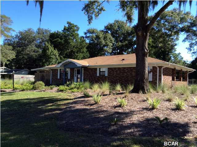 Not many homes in this price range are as well-maintained as this Lynn Haven property. From the landscaping to the interior, this home is truly move-in ready. Step through the front door into the spacious yet, cozy living room. The living room is open to the kitchen, creating a great space for entertaining. The large kitchen features a pantry and plenty of cabinet space. There is also an oversized Kohler sink with a new faucet. Enjoy the view of Davis Lake from the kitchen window, too. You may enjoy your meals at the breakfast bar or there is plenty of room for a dining table. The master bedroom is carpeted and has an extra-long closet with double doors. The master bath features a separate sink/dressing area with a pocket door. The hall bath is set up the same way and also has a
