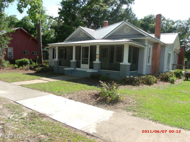 NEED A HOME WITH LOTS OF ROOM FOR YOUR GROWING FAMILY? This beautifully renovated, country-style home is it! Home features living room with fireplace, den with fireplace, 4 bedrooms with extra room that could serve as another bedroom or home office and two baths. New metal roof, new electrical wiring and updated plumbing, refinished hardwood floors,new vinyl flooring and new carpet in the bedrooms add an updated look and feel to this charming home. New hot water heater and dishwasher have a three year warranty. Screened porch on the front and screened patio on the back overlooking a large back yard. Storage building out back has new roof. Come look and see if this isn't where you would want to hang your porch swing!