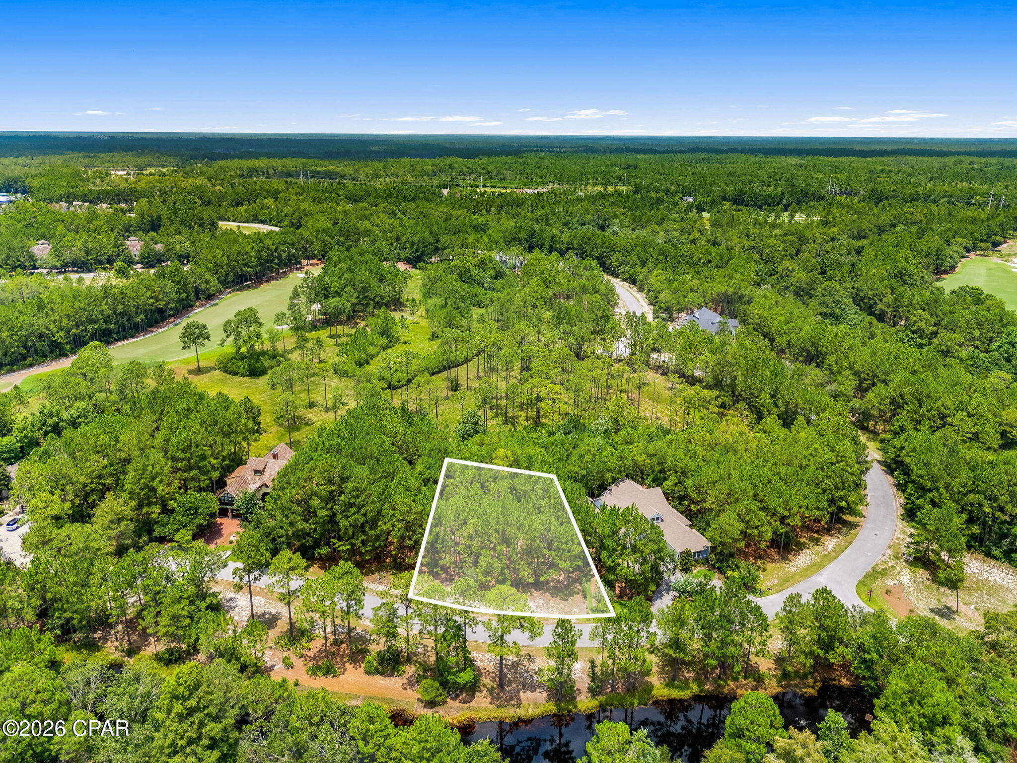 Discover the perfect opportunity to build your dream home in the prestigious gated community of Wild Heron. Located at 1509 Sweetbay Trail, this beautiful homesite is tucked away on a quiet street and offers exceptional privacy, surrounded by mature pines and native Florida landscape. The generous lot provides an ideal setting for a custom home while preserving the peaceful, natural beauty that makes Wild Heron so special.

Enjoy easy access to world-class amenities, including pool, hot tub, firepit, grill, fitness center, boat house, and access to Lake Powell; Florida's largest coastal dune lake. Miles of walking and biking trails weave throughout the community, creating the perfect balance of luxury living and outdoor recreation.

Conveniently located just minutes from the white-sand beaches of the Gulf, Scenic Highway 30A, Pier Park, dining, shopping, and Northwest Florida Beaches International Airport, this is a rare opportunity to own property in one of Panama City Beach's most sought-after gated communities.

Build the custom home you've always envisioned and experience the unmatched lifestyle that only Wild Heron has to offer.
