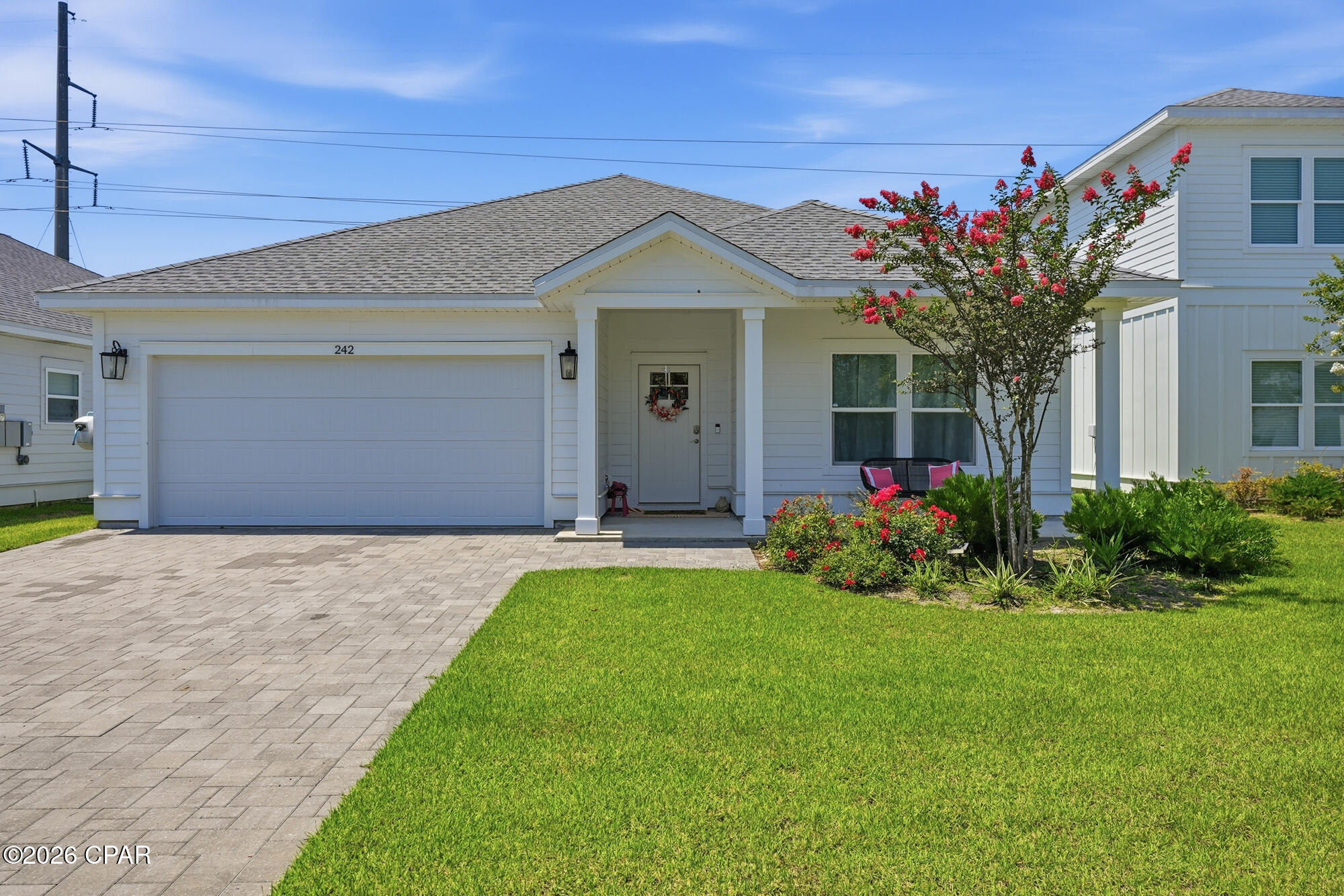 Built just three years ago, this chic one owner, 3-bedroom, 2-bath home is located on the coveted west end of Panama City Beach in the gated community of Laguna Haven. 
From the moment you step inside you'll appreciate the bright and open floor plan, featuring 9-foot elegant tray ceilings, luxury vinyl plank flooring and abundant natural light throughout. The gourmet kitchen is designed to impress with quartz countertops, soft-close cabinetry, stainless steel appliances, a large island and plenty of room for entertaining.
The spacious primary suite offers a true retreat with a walk-in closet and spa-inspired bathroom featuring a custom tiled walk-in shower and dual vanities.
Enjoy Florida living year-round from the custom-built screened Florida Lanai, an ideal extension of the living space, that overlooks the fully fenced backyard. Cozy evenings are made even better around the custom-built electric fireplace, creating the perfect atmosphere for relaxing after a day at the beach.
Additional highlights include hurricane shutters, a doggy door, paver driveway, two car garage, covered front porch and designer finishes throughout. Also located in Flood Zone X, meaning flood insurance is not required.
Whether you're looking for a full-time residence, a second home, or a turnkey vacation rental, this property checks every box. Stylish, low-maintenance, and ideally located near shopping, dining, entertainment, Pier Park, 30A, Northwest Florida International Airport (ECP), Dog Park, Camp Helen, PCB Conservation Park, Dollywood's Pirate Voyage dinner & show    and the sugar-white sands and emerald waters of the Gulf Coast's most beautiful beaches--This is coastal living at its finest! Call today to schedule your showing.
