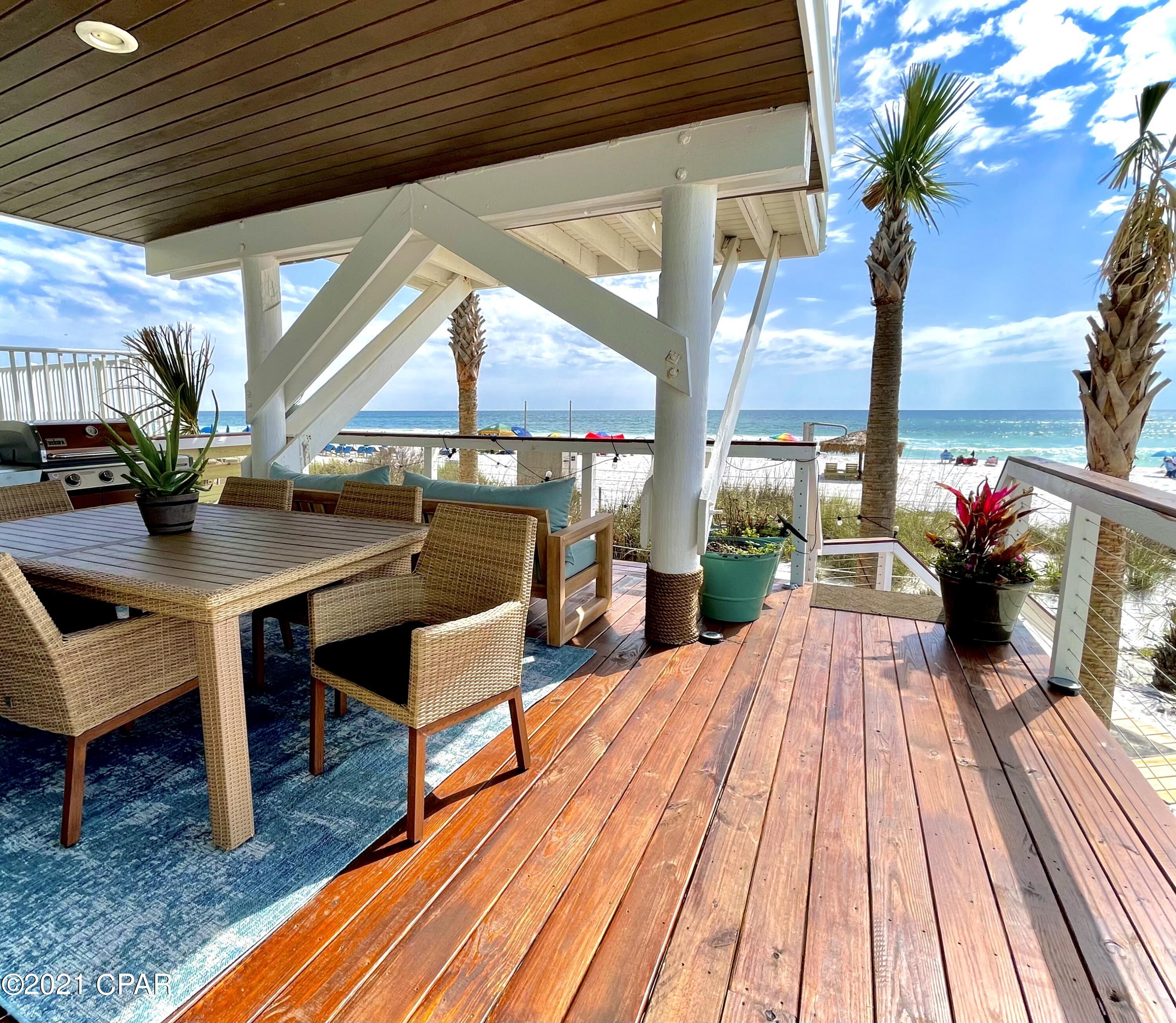 CURRENTLY UNDER CONTRACT, SELLER ACCEPTING BACKUP OFFERS.  GULF FRONT!  Welcome to the Palapa House.  Just steps to the turquoise waters on the beautiful Gulf of Mexico and shimmering white sands plus no HOA fees! This is a rare jewel as you own all the way to the water's edge! RENTAL INCOME AS FOLLOWS:

2017 $76,374, 

2018 $95,765

2019 $79,654

2020 $70,433

2021 Jan.-August $140,000. Take a relaxing walk or jog on the beach right out your back door or enjoy the sea breeze under your very own one-of-a-kind private Palapa!  Balconies upstairs and down to enjoy the gorgeous sunsets or have some great cookouts!  Guests return to the Palapa House year- after- year. New HVAC 2020. Beautifully furnished and remodeled with updated kitchen and baths.  Just a short drive to St. Andrew State Park nt a pontoon boat or wave runner and take a ride to Shell Island, and fabulous waterfront restaurants including two 
Golden Spoon Award Winners.  No waiting for an elevator here!  This is a wonderful home to create many family memories!  Less than 7% of gulf front tracts in PCB have a deeded lot that include the white sandy beach as part of the property. This house was originally built by Regency Towers architect and is positioned further onto the beach than any other property insuring forever gulf views to the east and west. Flood insurance is very inexpensive due to being grandfathered in to an older non- flood map. The palapa was city approved to be built on the beach because of the rare extended property lines that stop at the waters edge.  Sleeps 11.  The three bunks are twin XL.  New high-end sunbrella outdoor furniture, April 2021.  New queen mattress in the downstairs bunkroom.  New Murphy bed and queen-size mattress.  Mature palm trees installed with automatic irrigation system as well as 8x40 privacy fence.  Two new beach decks built and stained with custom cable rails also installed April, 2021.