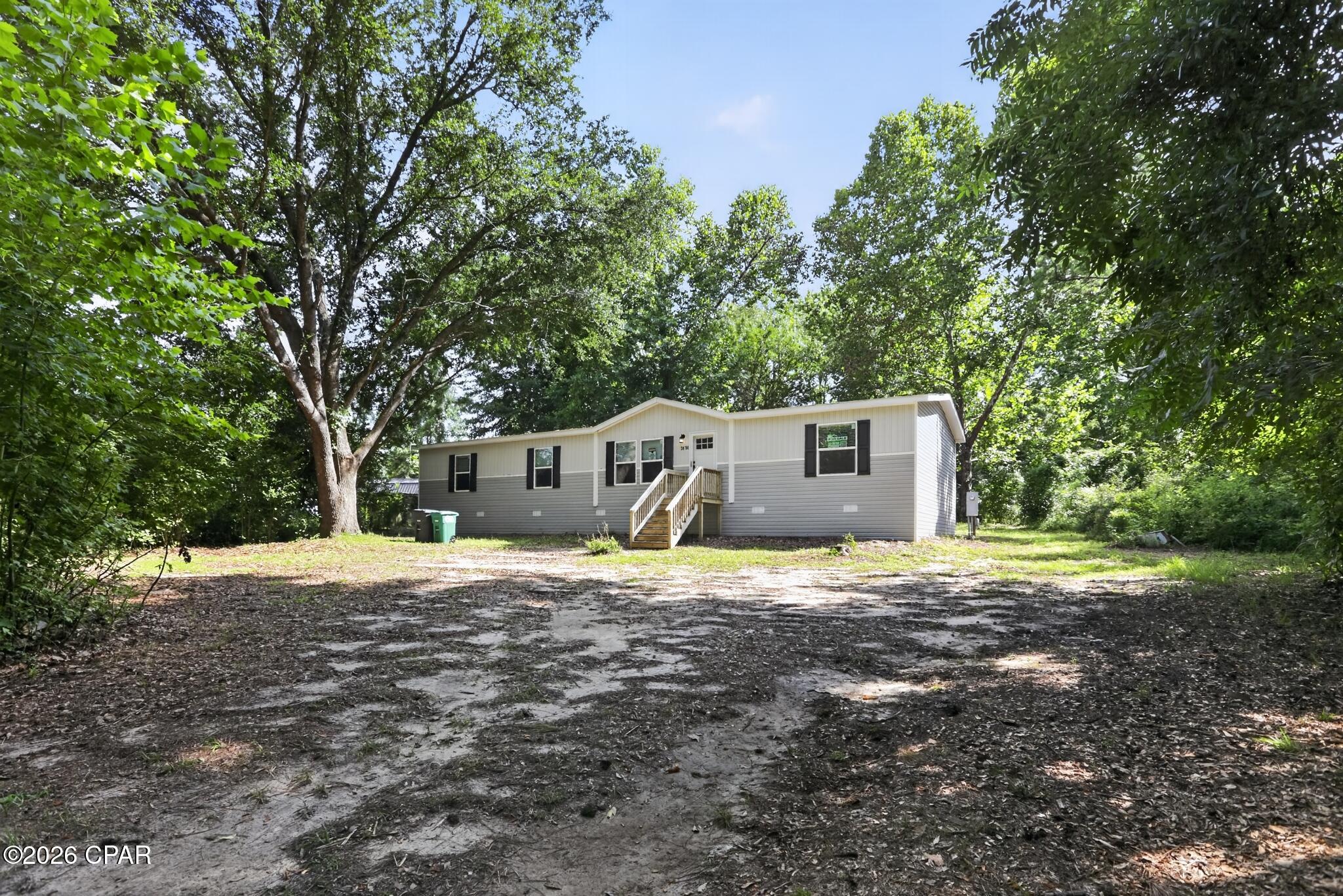 Like-new 2024 manufactured home situated on a spacious 1.04-acre lot in Tallahassee! Enjoy the privacy and room to spread out while remaining just minutes from shopping, dining, schools, and everyday conveniences. The expansive property offers plenty of space for outdoor living, gardening, a workshop, or additional storage. Title is retired - land/home package- no lot rent. Whether you're looking for a primary residence or an investment opportunity, this move-in-ready property offers the perfect combination of modern living and country charm. Seller financing and zero downpayment options available.