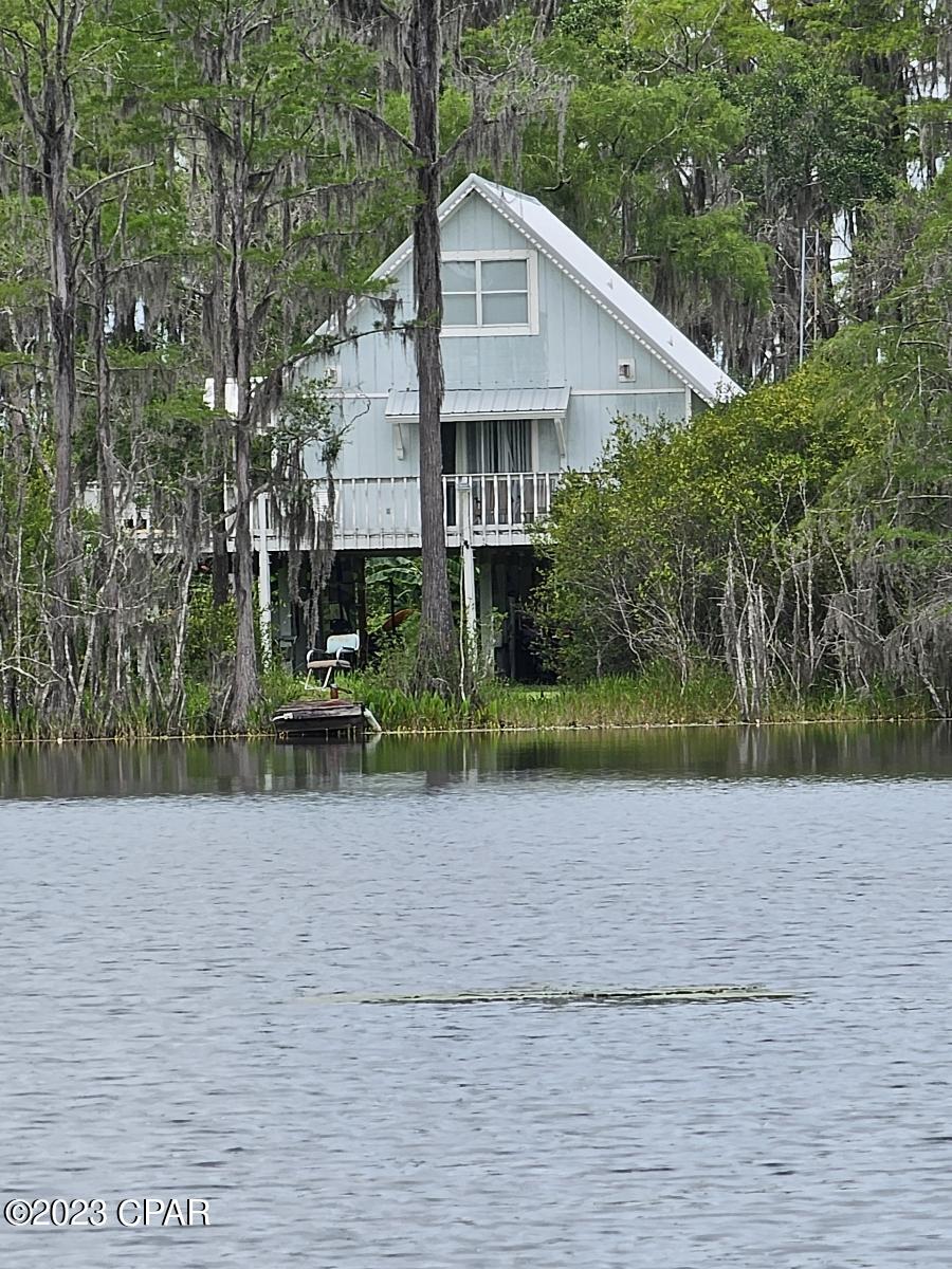 Motivated seller, Move-in ready and recent updates, this 3-bedroom, 2-bath home is nestled on 11 private acres at the end of a dead-end road in a gated community, offering the perfect blend of privacy and convenience. Ideally located between two lakes, this property is perfect for those who enjoy fishing, boating, and the outdoors. The home features a functional floor plan, comfortable living spaces, and recent updates throughout. The expansive acreage provides endless opportunities for recreation, gardening, animals, or adding a workshop or additional outdoor living space. Residents enjoy access to community amenities, including boat ramps for easy lake access. Best of all, there are no HOA fees. Whether you're searching for a full-time residence, vacation home, or private retreat, this unique property offers the space, location, and lifestyle you've been looking for. (more photos coming soon)