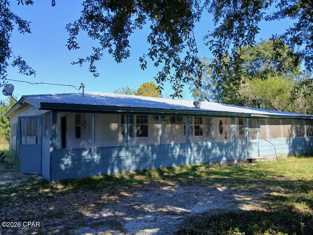 Totally updated 4 bedroom,3 full bath,2 master bedrooms,metal roof,900 sf of covered,screeneded porch,lakefront(stocked of fish) and separate large pond.Fruit trees,mature oaks.Homestead potential,one more home can be built per zoning.Secluded but close to everything.5 minutes to Ace hardware,supermarkets,gas station,restaurant,school.20 minutes to Mariana(department stores,Wells fargo bank,Lowes,Autozone,Super Walmart,HWY I 10,and many other stores and services.