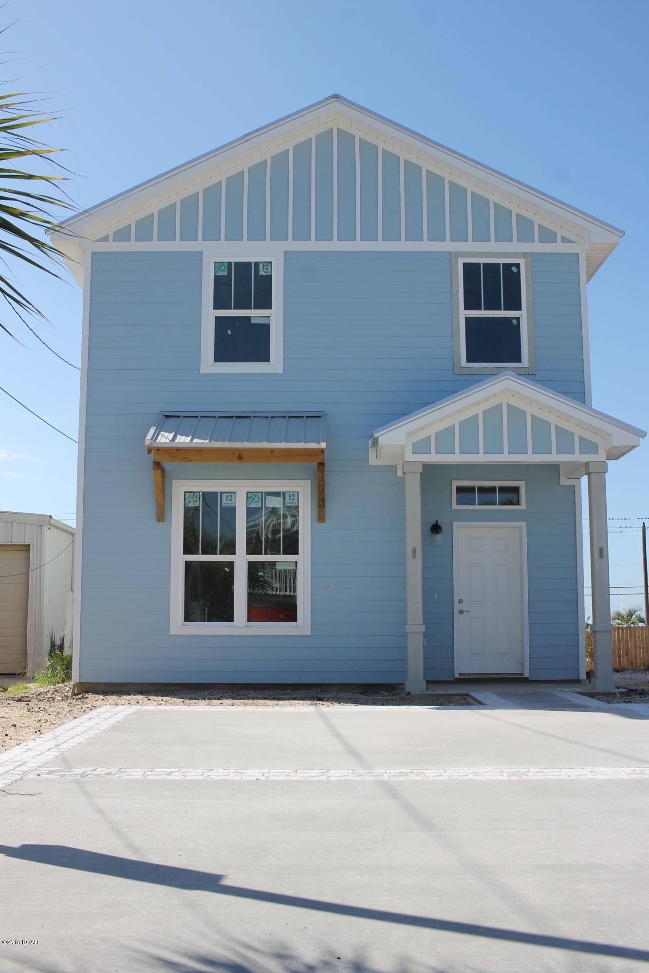Stunning New Construction Beach home on Panama City Beach with majestic open views of the Gulf of Mexico..... This home offer 4 bedrooms 3 baths and has beautiful custom cabinets, granite counter tops, fenced back yard, and just a few feet from the beach! This home is a MUST see at this price... Home offers metal roof and would be a great home to live in or to use as investment property.