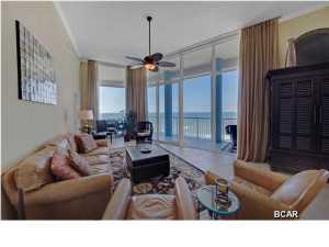 JUST REDUCED! Views, views and more views from this absolutely stunning three bedroom, three bath west end unit in the exclusive Palazzo! This is a one of a kind penthouse unit unique to the building boasting 12 FOOT CEILINGS with floor-to-ceiling windows throughout! These awesome windows not only capture the spectacular views of the white sandy beaches and the emerald waters of the Gulf Coast, but the glass itself has additional tinting to block UV rays keeping the unit cooler on summer evenings. Western sunset views are stunning from either of your two private Gulf front balconies, totaling 415 feet! This spacious unit boasts a very open floor plan and 20'' tile floors throughout. The kitchen features thick solid granite countertops in the desirable baltic brown, custom stone tile