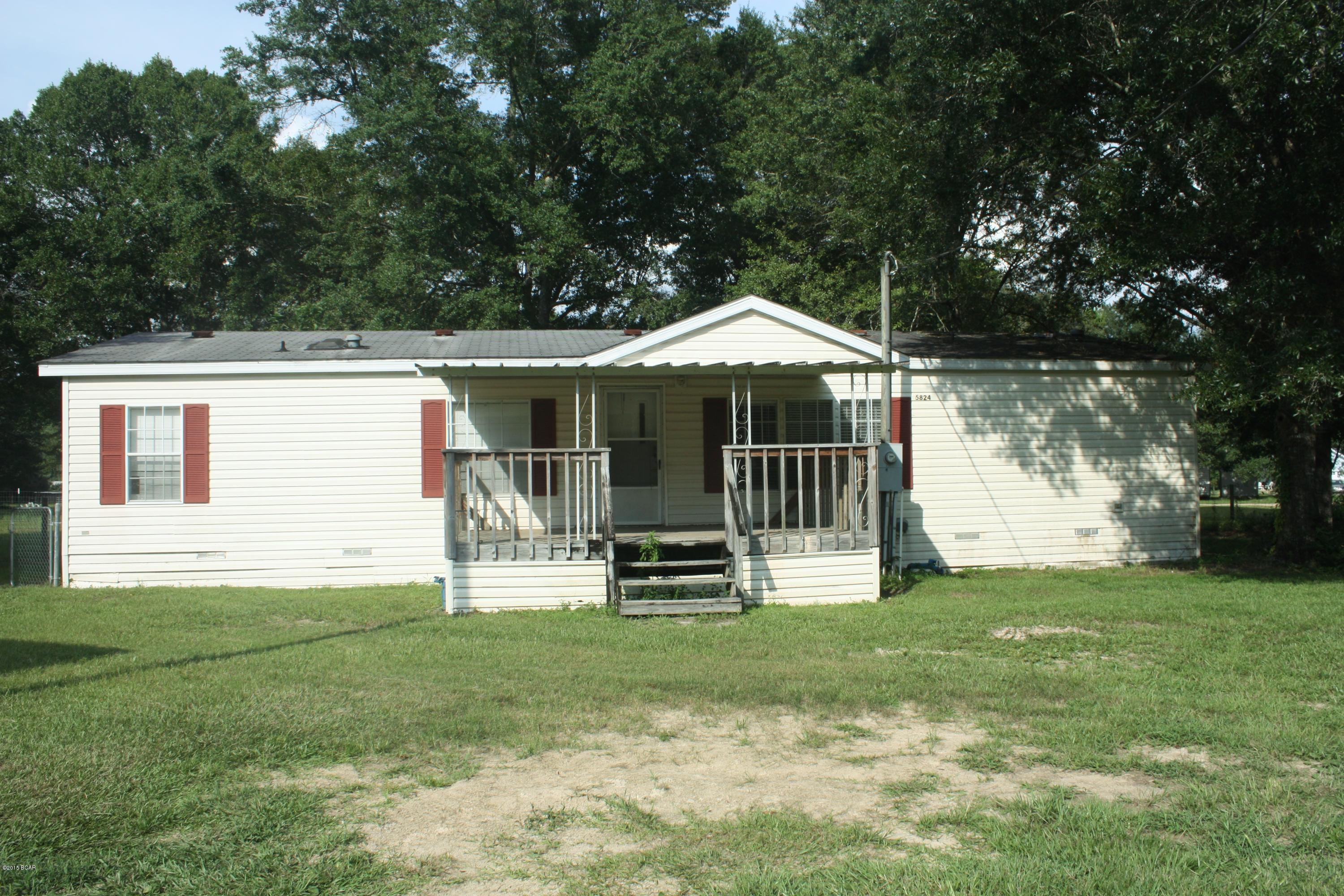 Country living at its best! Almost an acre of land with a large fish pond. Large work shop in the front.  Most of the yard is fenced in for your dogs or horses. Inside is nicely updated, brand new solid wood cabinets,newer appliances,ceramic tile in kitchen,laminate through out the rest of the house. Bonus room perfect for a home office. Huge walk-in closets in each bedroom. Home needs a little bit of work. Great location, not far from H.G. Harders recreational complex. All paved roads.THIS IS A SHORT SALE. SALE REQUIRES BANK APPROVAL-ALL SIZES, DIMENSIONS, SQUARE FOOTAGE, SCHOOLS AND AGE SHOULD BE VERIFIED.