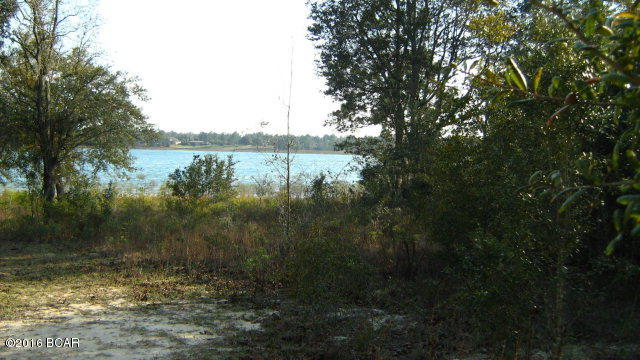BEAUTIFUL 1/4 AC LOT ON BOAT LAKE IN SUNNY HILLS S/D.