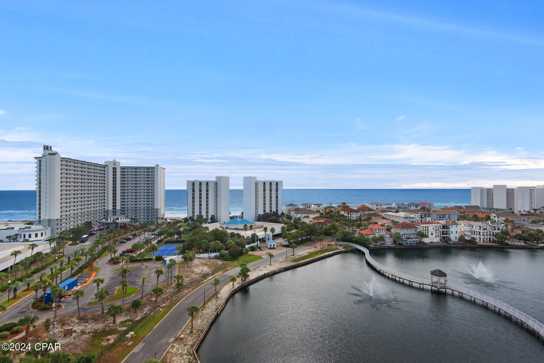 Discover the epitome of luxury in the stunning 11th floor upgraded corner 3 bedroom 3 bath unit with wrap around balcony, offering breathtaking, panoramic views of Destin, the gulf, and coastal lakes. Enjoy front-row seats to stunning sunsets and dazzling weekly seasonal firework displays. This rare gem also includes a deeded covered parking space. Perfectly positioned in the heart of Destin, you are mere steps away from the vibrant Destin Harbor. This exceptional unit showcases numerous upgrades, including elegant vinyl flooring throughout, sleek quartz countertops, and custom designer furnishings. The bathrooms have been remodeled with premium Bath Fitter installations. The open-concept kitchen, dining, and living areas create an expansive setting ideal for family gatherings and upscale entertaining. Effortlessly transition between indoor and outdoor living as sliding glass doors connect the living room and master suite to the balcony, offering unparalleled views. The third bedroom provides additional privacy and versatility, featuring a kitchenette with a microwave, refrigerator, sink, a private balcony, and a full bath. Convenience is further highlighted with a stackable washer and dryer, a pantry, and an owner's closet for extra storage. Located within one of the Emerald Coast's most sought-after vacation complexes, this guard-gated resort boasts an impressive array of amenities. Beyond the numerous on-site features, owners and guests also enjoy exclusive access to the facilities at Pelican Beach Resort, enhancing their recreational and leisure options. Bask in a sun-soaked beach day on the private beach, meticulously maintained by Pelican Beach Resort, just a 5-minute walk along a scenic boardwalk from The Terrace. Stay active on the tennis courts or in the well-equipped gym, unwind at the Tiki Bar, or rejuvenate in the hot tub or steam room. Cool off in one of several pools, including the stunning 114-foot zero-entry pool. Find tranquility in the sauna or spark some fun in the game room. For even more excitement, Big Kahuna's Water Park is conveniently located just across the street, while Destin's finest attractions, shopping, dining, and vibrant nightlife are mere moments away. Perfect as a primary residence, second home, or a lucrative vacation rental, this turnkey unit, with its thoughtful upgrades, is ready for your next luxurious chapter.