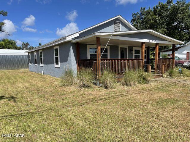Come enjoy Florida living from your covered front porch in this quiet neighborhood.  This home was completely remodeled in 2019 to include a new roof, windows, flooring, fixtures, and paint.  The kitchen and the bathrooms were also updated during the renovation.  Work on your hobbies in the detached garage- the bay doors on each end will create a lovely breeze for your summer nights.  Vacant and easy to show!