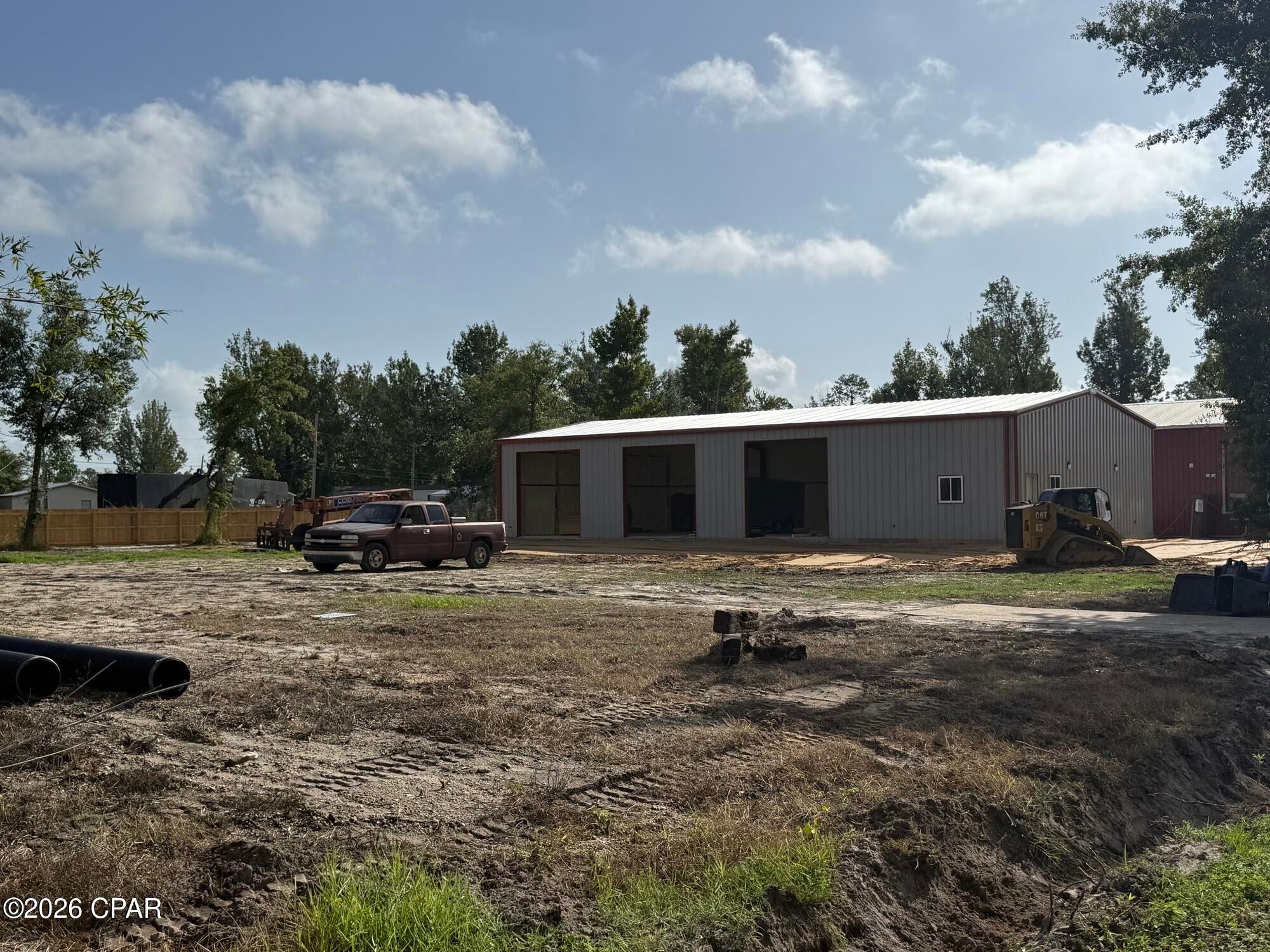 Position your business in one of East Panama City's growing industrial corridors with this newly constructed 3,200 SF warehouse and office facility at 5615 Wallace Road. The property features approximately 2,500 SF of warehouse space and 700 SF of air-conditioned office space with three 12' x 12' overhead doors, three phase power, 14' eave height and 16' clear height at the peak.

The site also includes an approximately 200' x 200' outdoor laydown yard, providing ample space for equipment, fleet parking, material storage and contractor operations. Additional features include semi-truck access, three restrooms including one with a shower and City of Callaway water and sewer. Conveniently located with easy access to Tyndall Parkway, Highway 22 and US Highway 98, this property is well suited for contractors, service companies, distribution, light industrial and warehouse users.