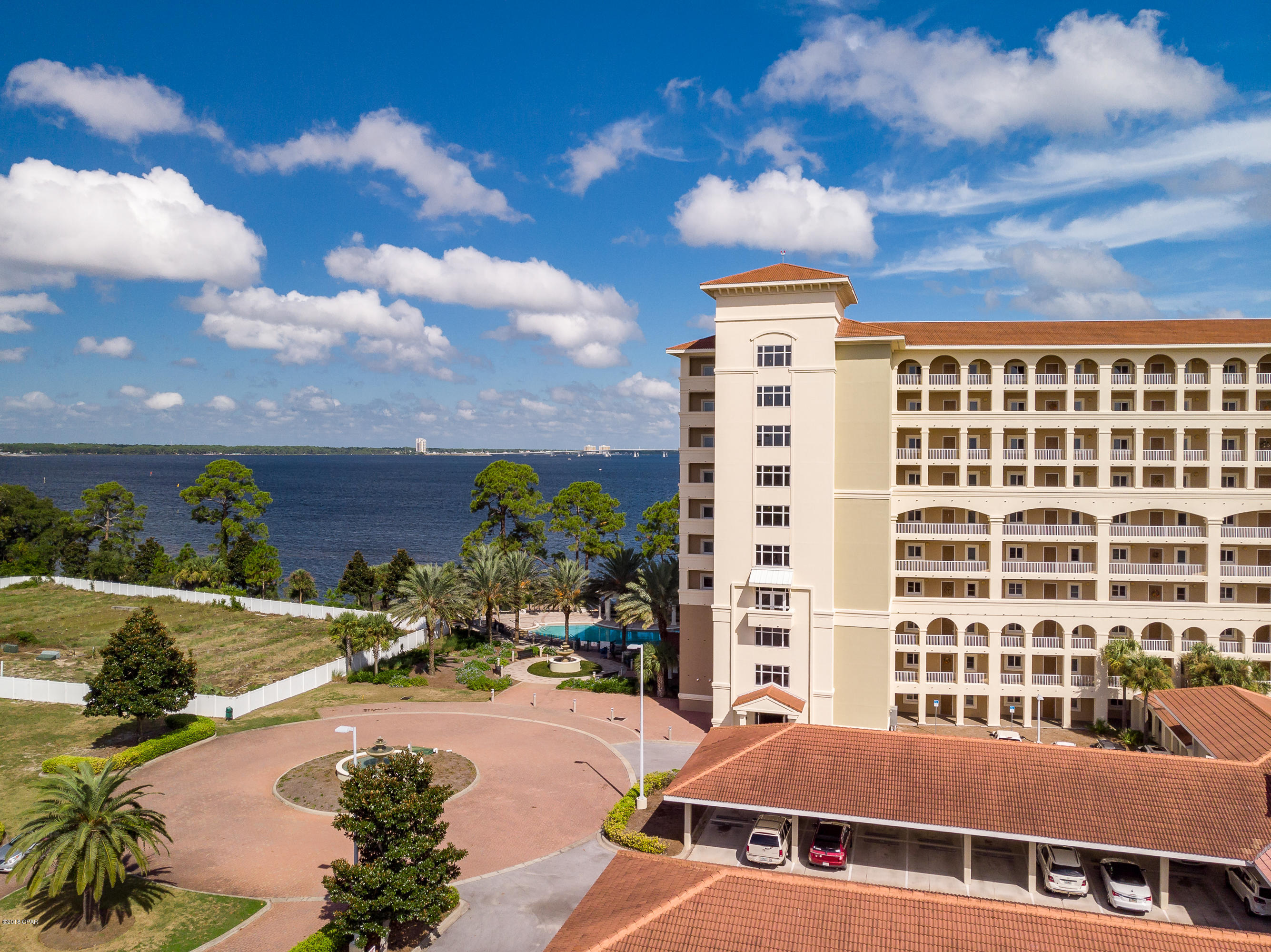 **SAVE THOUSANDS IN CLOSING COSTS! SELLER WILL FINANCE WITH 15-20% DOWN, 3 TO 5 YEAR BALLOON ***  A condominium developer's dream lot! Future site of Panama City Beach's newest bay front condominium complex. 9 story, 99 unit complex can be built on this lot. Condo building to the right is the sister building so you can see what it can look like when finished. Over $1,900,000 of  infrastructure already in place. Canoe or kayak out into the bay right from your shoreline! Just a short boat ride out to the open gulf. Fitness center and game room/lounge in sister building will be available to owners. All info is approximate and should be verified by buyers if important.