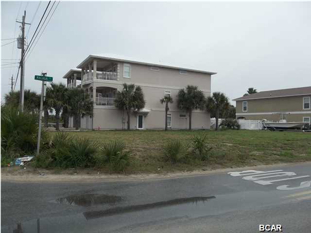 Great Gulf views of dedicated beach from your second and third floor balcony's as well as large gulf views from the front yard. Just a stroll across the street to sandy white beaches and emerald waters! Minutes to Pier Park, entertainment, shopping and restaurants. This property has enough room to build a pre approved 5 bed 5 bath home with over 2700 square feet of living area with a Otis elevator. Annual rental projections on this home is 45,000 plus!