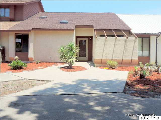 Nice 2 bedroom 2 bath townhouse. Property has fireplace in the living room, sliding glass doors off of master bedroom, fenced yard, and more. All information is approximate and should be verified. Sold AS IS.