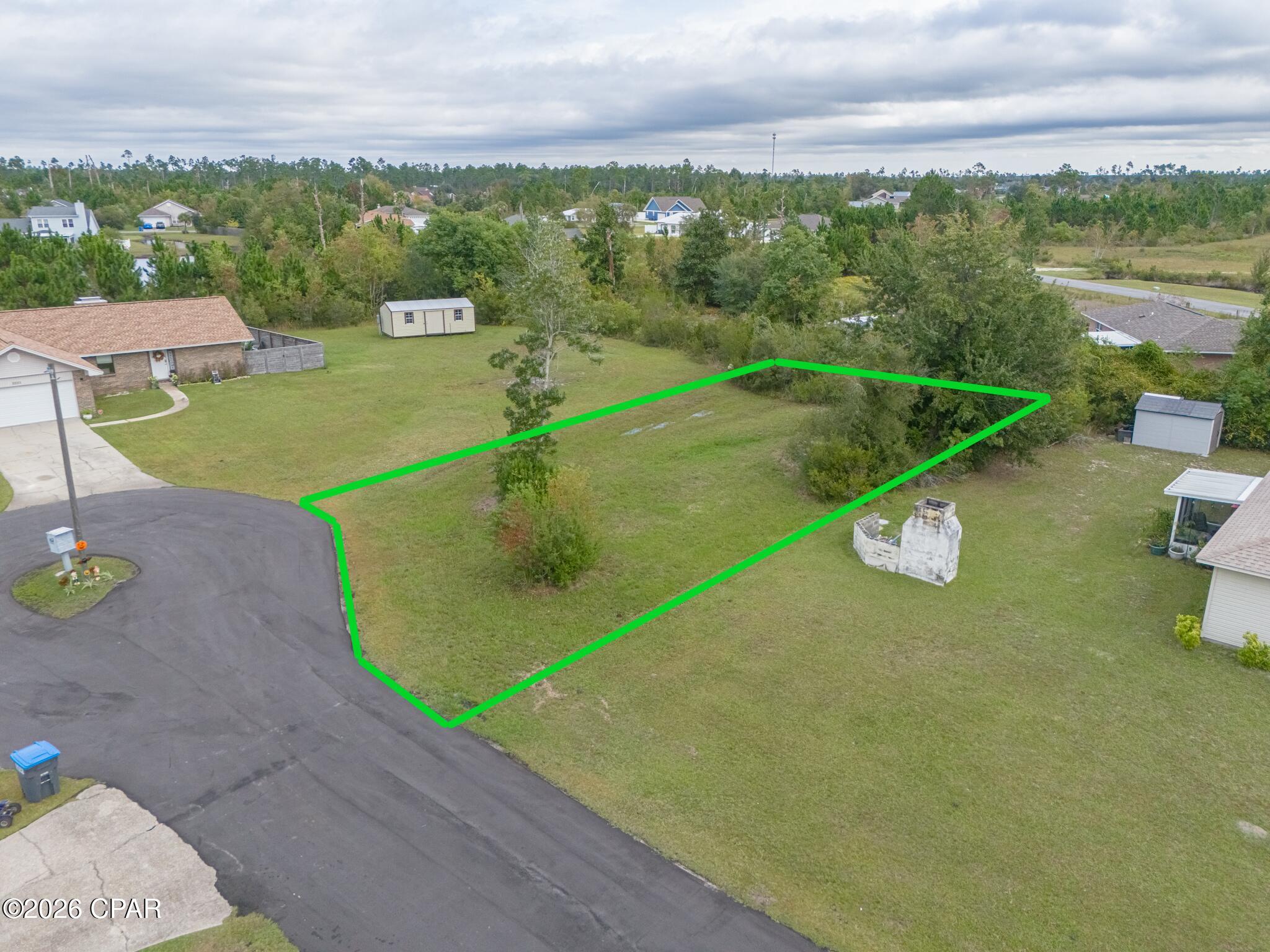 Welcome to 1997 Par Drive, tucked away in the peaceful Sandy Creek Ranch & Country Club—a charming, established community known for its privacy and welcoming atmosphere. This cleared 0.214-acre lot sits at the end of a quiet cul-de-sac, offering the ideal setting to build your dream home. With utilities available, a low HOA of just $400 per year, and location in Flood Zone X (no flood insurance required), this property is both practical and full of potential. Whether you're planning a full-time residence or a coastal getaway, this lot provides a rare combination of affordability, convenience, and tranquility. Bring your builder and imagination—this prime homesite is ready to go and priced to sell!

Enjoy peace of mind knowing this neighborhood maintains a high standard of living — single-family homes only (minimum 1,200 sq. ft. heated and cooled). No mobile homes, stilt houses, modular builds, campers, or RVs are permitted. Outbuildings or sheds are allowed only once a primary residence is completed on the lot, ensuring a consistent, well-kept community look and feel.