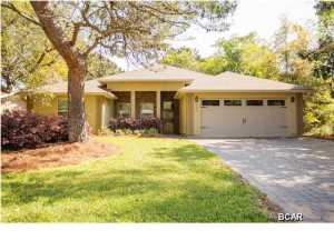 Beautiful open floor plan and just over a year old! Beautiful neutral colors and custom stained concrete floors. Window blinds on all windows and multi-room music. Great cabinetry and trim package. Large back porch with a great view out to the golf course. Water well for irrigation so no 2nd water bill. Very pleasant shaded sitting patio-would be great as a fire pit area. Plus, home includes 1 year paid family membership to ''Wyndham Bay Point Golf Resort & Spa'' located just up the street!!