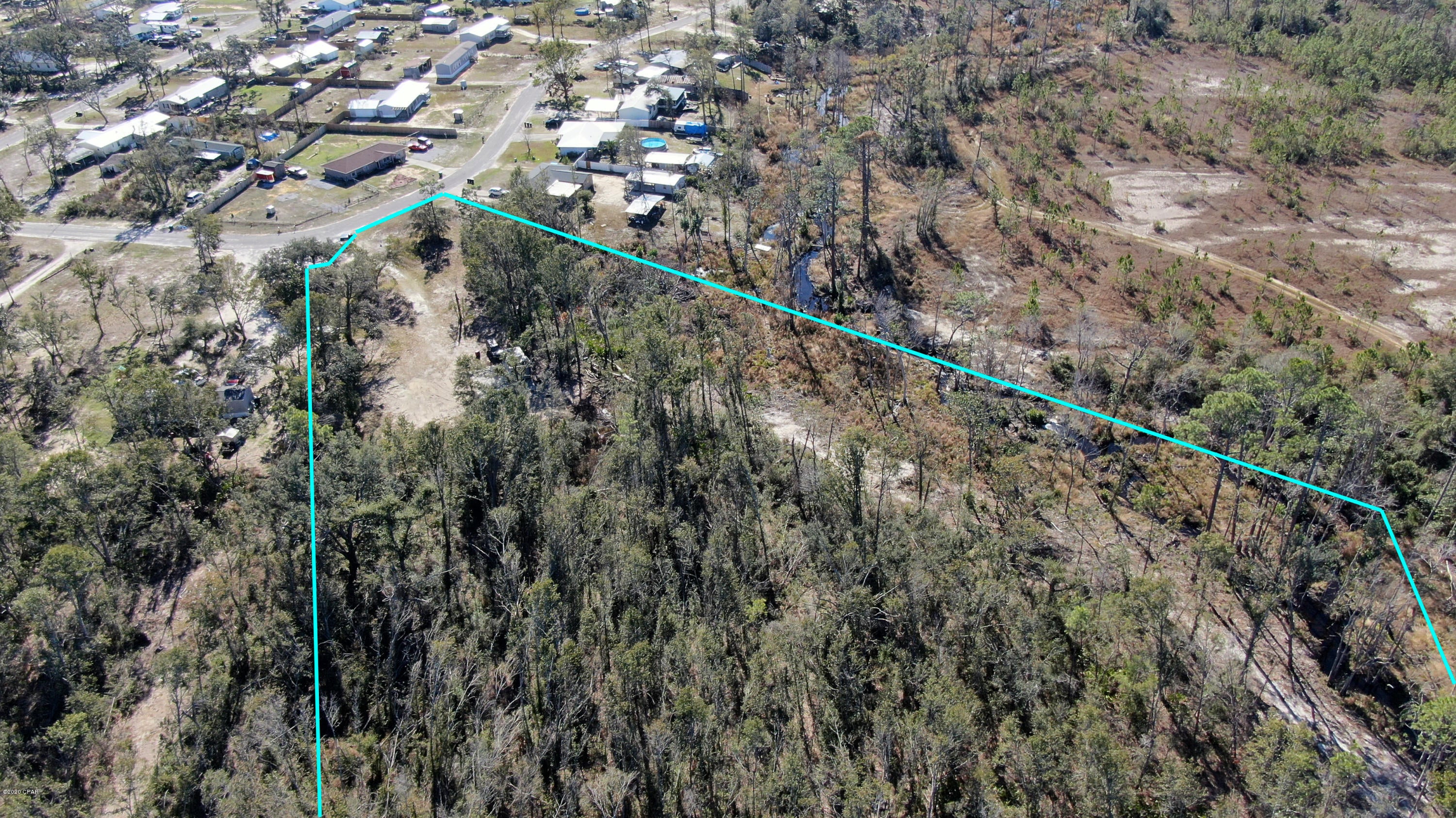 Perfect lot to build on, mobile homes are allowed. This lot has a 30 foot concrete slab perfect for a workshop or garage space. This is one of the biggest lots in the area and is mostly cleared. This lot backs up to vacant land that provides quiet and privacy.
