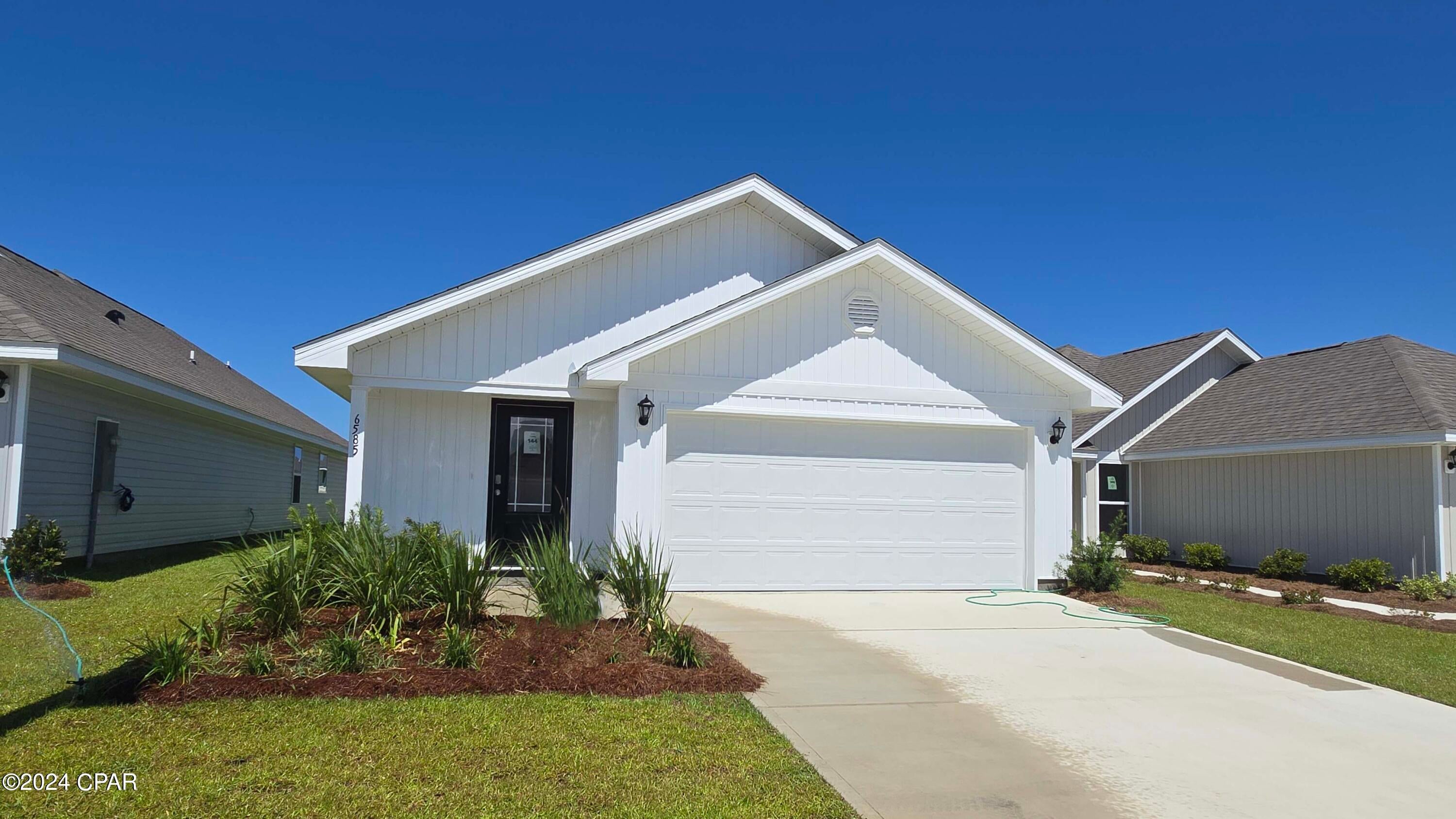 New construction home located at 6585 Canley Court. The Burke is a 3-bedroom 2 bath, 1384 square foot home with an open floorplan.  This home features a large living area, open to kitchen and dining area. The kitchen features a center island with white cabinetry, stainless appliances including a stove, microwave and dishwasher. Interior features of this home include stainless appliances, EVP vinyl flooring, durable laminate countertops and carpet in the bedrooms. Liberty neighborhood is conveniently located in beautiful Panama City off Star Avenue near 231. Located just 25 minutes from Tyndall Airforce Base, 20 minutes to hospitals, and less than 15 minutes to shopping, restaurants, and grocery stores you will be amazed at the convenience once you enter the winding entrance to this beautiful sanctuary. Liberty, D.R. Horton's premier new lifestyle community, offers a 7,500 square foot community center with full gym, wellness rooms and much more. Additionally, behind the community center is a water wonderland with resort style pool, splash pads, and an outdoor grilling kitchen with seating.