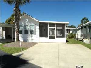 Emerald Point Community with so much to offer. Gated community with Pool, Clubhouse, Private Lake and Lakeside Gazebo for relaxing. This lovely 1BR 1BA mobile home can be yours today. Great vacation get-away or primary home. Fully equipped kitchen, comfortable living/dining room are furnished and home has been very well kept. The spacious 10' x 20' screened porch, 10'x 12' storage shed, complete with electricity great if you need a shop or storage. New A/C/Heat Pump and Hot Water Heater. The grounds at Emerald Pointe are beautifully maintained. All measurements are approximate.