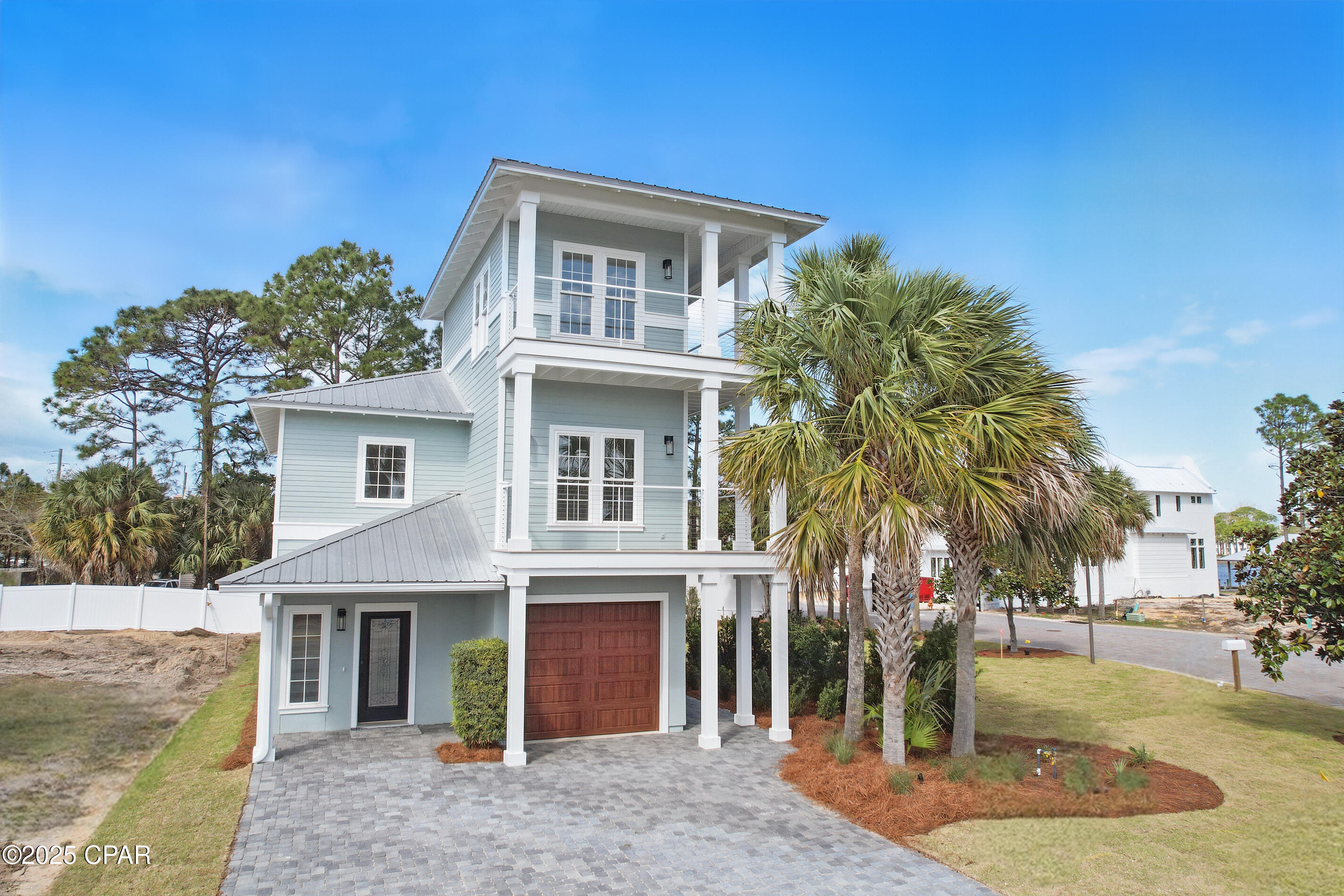 Newly renovated 5-Bedroom Home in Grand Lagoon Pointe includes BOAT SLIP & LAGOON to GULF ACCESS. Perfectly designed for coastal living, this home offers breathtaking views, luxury finishes, and an ideal location with direct access to the lagoon and Gulf of Mexico.
The open-concept layout that blends modern style with comfort. The home features a first floor primary suite, gas fireplace, perfect for relaxing evenings, and large windows that invite natural light throughout. The newly tiled patio provides the perfect outdoor space to unwind and entertain guests. The third-floor wraparound patio offers panoramic views of the lagoon and Gulf, giving you a front-row seat to gorgeous sunsets and serene mornings. For boaters, this home comes with a private boat slip, offering direct access to the lagoon and Gulf waters. 
Located in a gated community and residents also enjoy the luxury of a community pool. Buyer to verify any information deemed important.