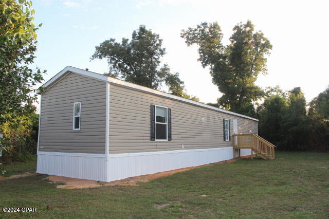 Attention Buyers!  At full price Seller will contribute up to $6,000. towards your closing costs and or pre paids for this Charming Home in Altha. Nestled within the town limits of Altha, this well-maintained property offers a perfect blend of comfort and convenience. With a split bedroom floor plan, this home is currently leased, making it an ideal investment or a chance to make it your own. Enjoy the peace of a small town with access to great schools and essential amenities, including a grocery store and Ace Hardware. Just 15 minutes from Blountstown, where a state-of-the-art hospital is under construction, and less than 20 minutes to Walmart and a variety of restaurants. The property is surrounded by a thick tree line for added privacy, featuring a cozy covered deck at the back—perfect for relaxing in the outdoors. Don't miss this opportunity!