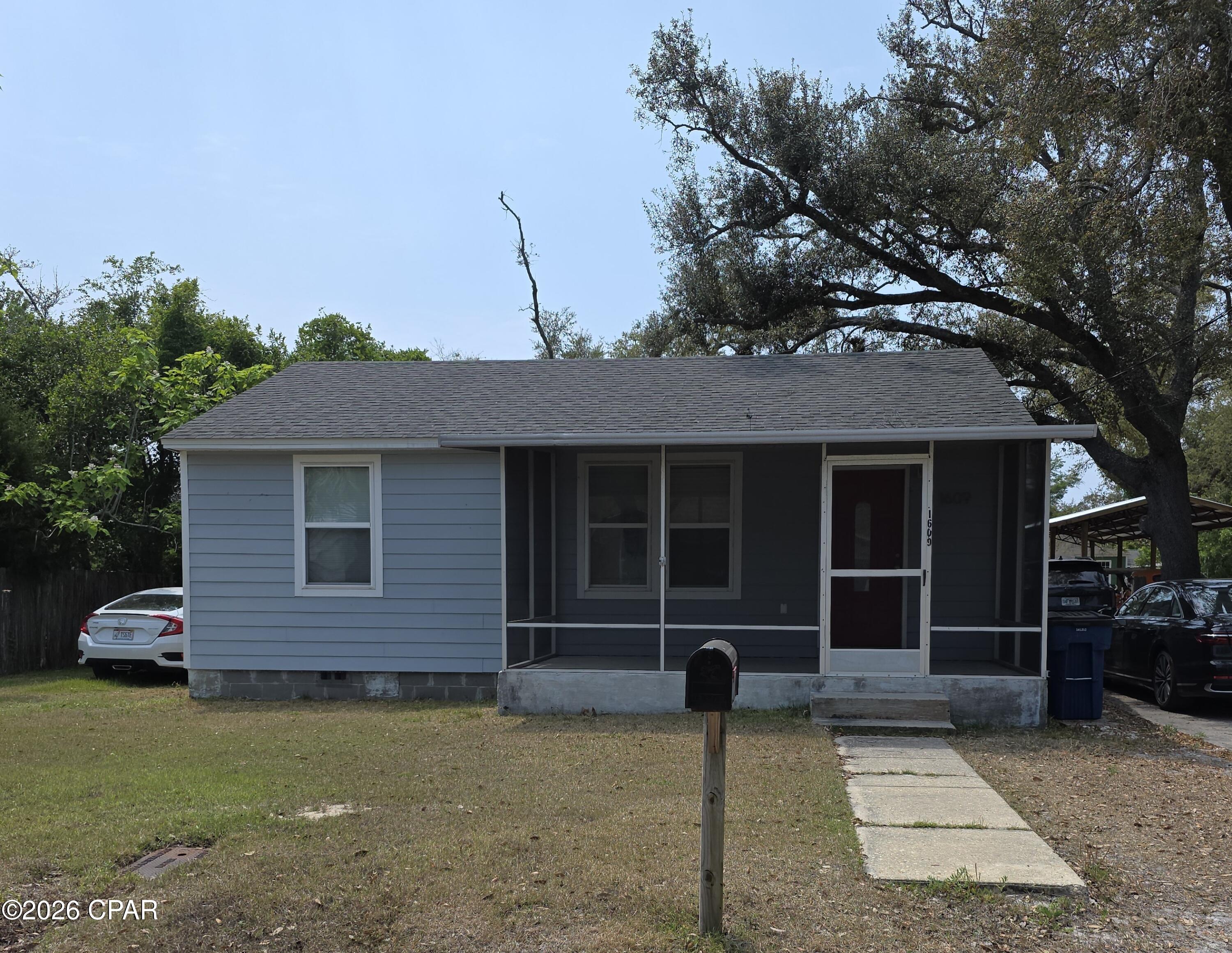 Charming Coastal Cottage in the heart of historic ST. ANDREWS just one block from St Andrews Bay. This property features two bedrooms, 1 full bath, living room, kitchen/dining area, office area and two screened porches. Property has a large 60 x 120 lot with plenty of room for outdoor fun or an additional out buildings.  The home is zoned for the St Andrews neighborhood/CRA revitalization area (NR) and can be used for a primary home, second home, or short term rental,  Walk or ride your golf cart to the nearby restaurants, shopping, parks, downtown St Andrews for dining/shopping/festivals or taking in the sunsets over the Bay.