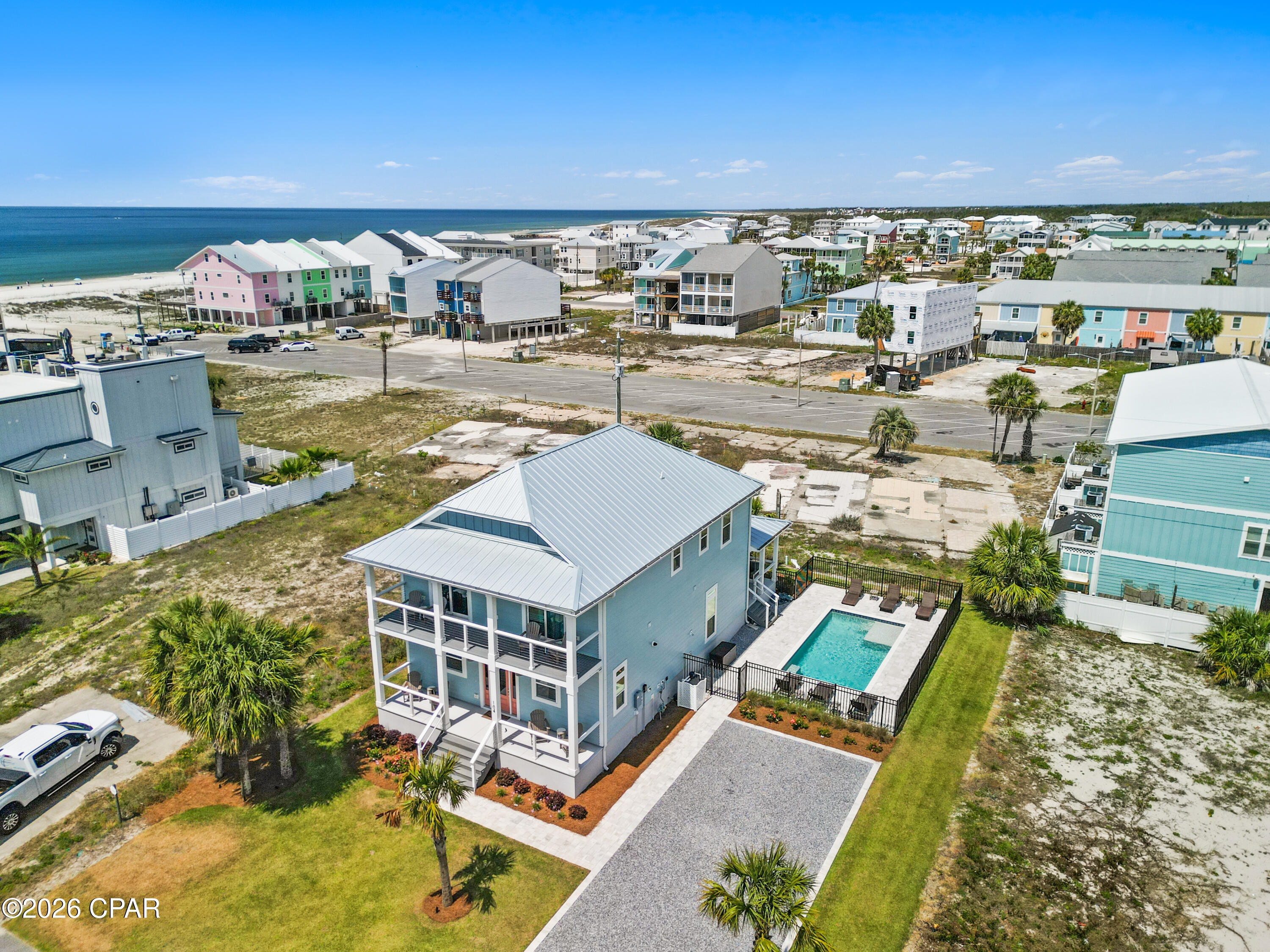 X FLOOD, PRIVATE POOL, GULF VIEWS! Virtual Tour available in listing! Experience elevated coastal living and impressive rental performance at this beautifully furnished Mexico Beach retreat. Built in 2023 and located just a short walk from the Gulf, this spacious five-bedroom, five and a half bath home has already produced approximately $84,000 in gross rental income during its first full year on the vacation-rental market. Offering buyers the rare combination of a luxurious beach getaway and an established income producing property. The thoughtfully planned interior provides 2,728 square feet of living space with plenty of room for owners, family and vacationing guests. An open kitchen, dining and living area creates a natural gathering place, while the upgraded GE Café appliances, generous island, pantry and stylish finishes make the kitchen both functional and inviting. Each bedroom enjoys convenient bathroom access, and the first floor primary suite offers added privacy and accessibility. An interior residential elevator makes moving between levels, and transporting luggage and groceries, effortless. Outside, the private gunite pool and landscaped gathering area provide a resort-like setting for afternoons in the sun, evening cookouts and relaxing after a day at the beach. Gulf views, multiple porches, an outdoor shower and a location near Mexico Beach's white sand shoreline further enhance the coastal lifestyle. Additional advantages include an X flood-zone location, no HOA, a metal roof, Hardie board exterior, natural gas, an on-demand water heater and public water and sewer. Offered furnished and ready for continued rental use or immediate personal enjoyment, this property is equally suited as a high performing investment, second home or full time coastal residence.